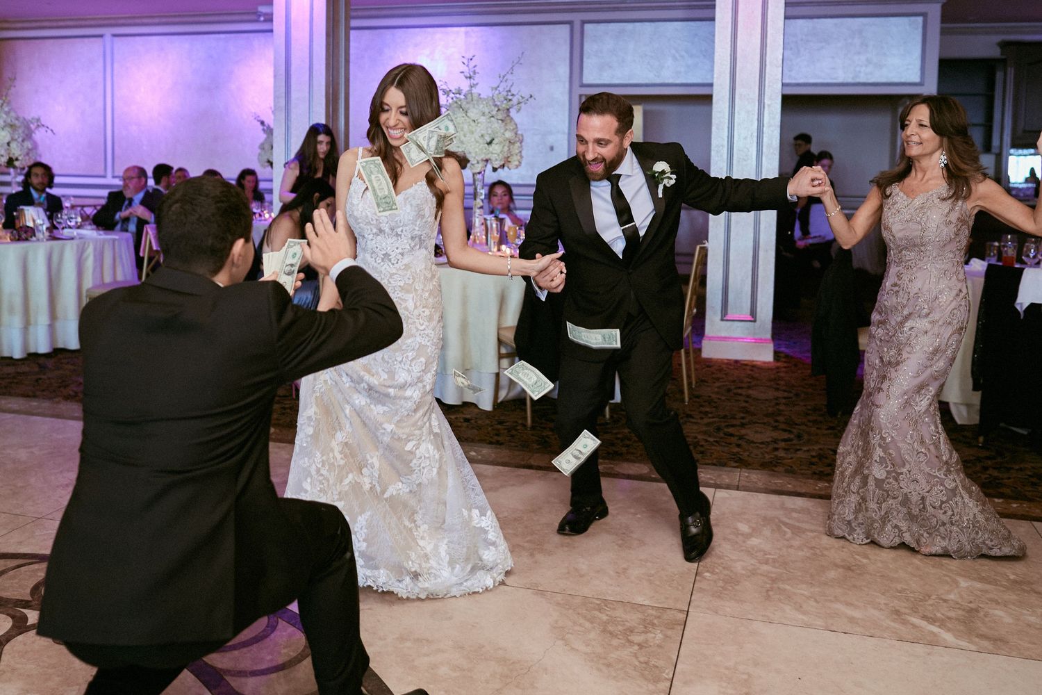 Nelstudios photographs a bride and groom at the Surf Club On The Sound in Westchester, NY, where they dance in a Greek wedding reception.
