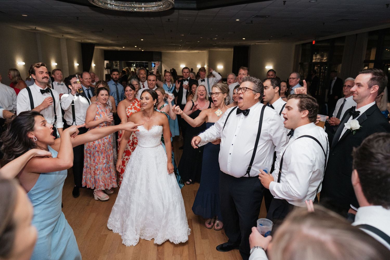Nelstudios photographs a real moment of the bride having fun on the dance floor at Whitby Castle, Rye, Westchester, NY.