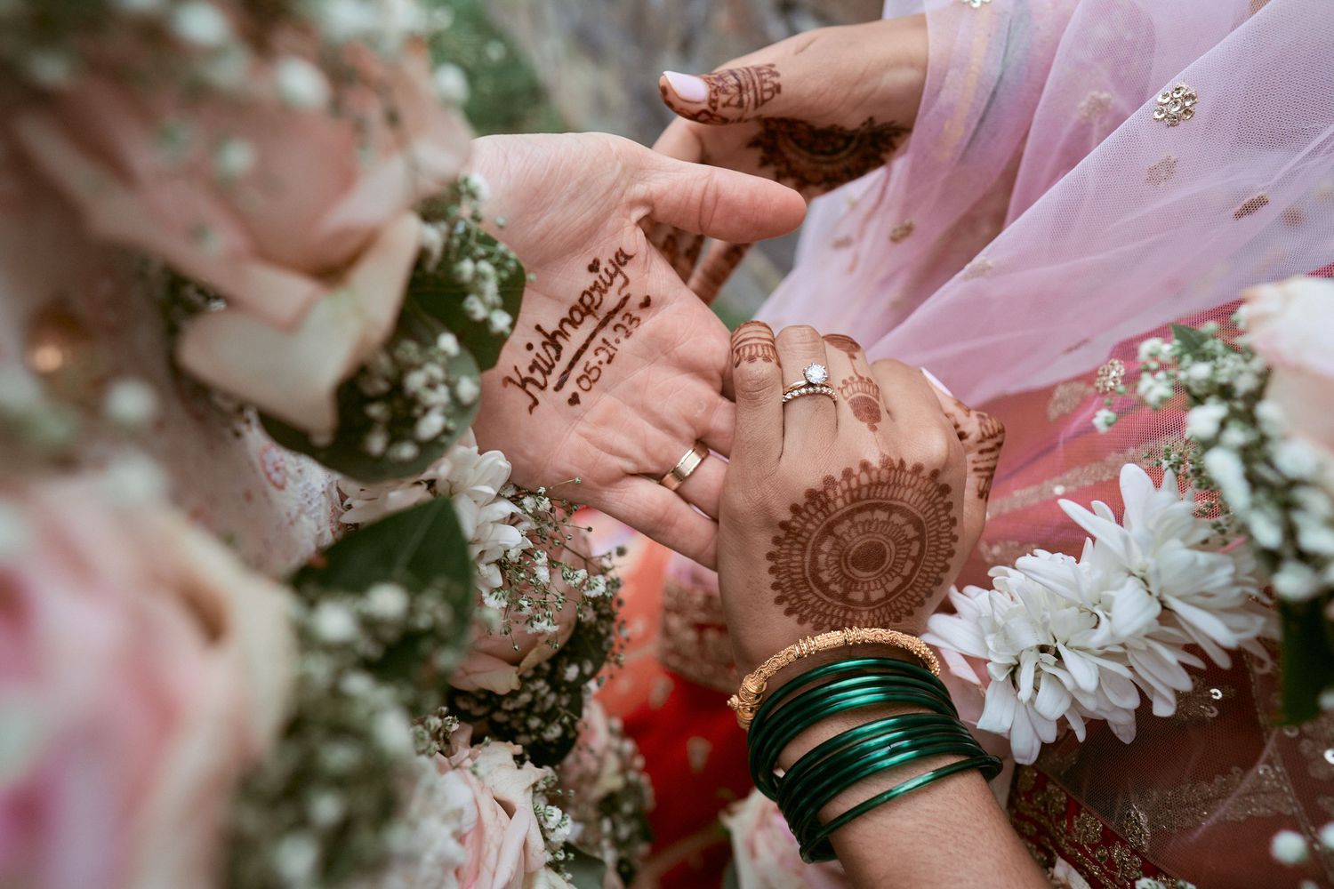 Nelstudios photographs a bride and groom at the Beach & Yacht Club in Mamaroneck NY, in Westchester, as they hold hands.