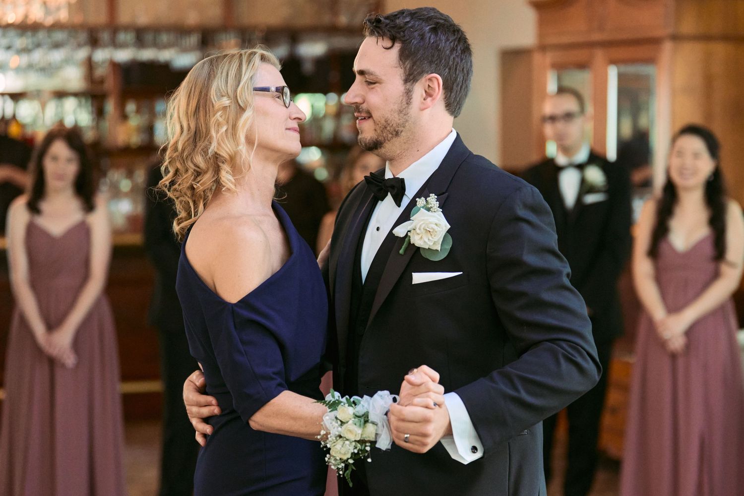 Nelstudios photographs a natural and authentic moment of the groom and mom dancing during their wedding in Westchester, NY.