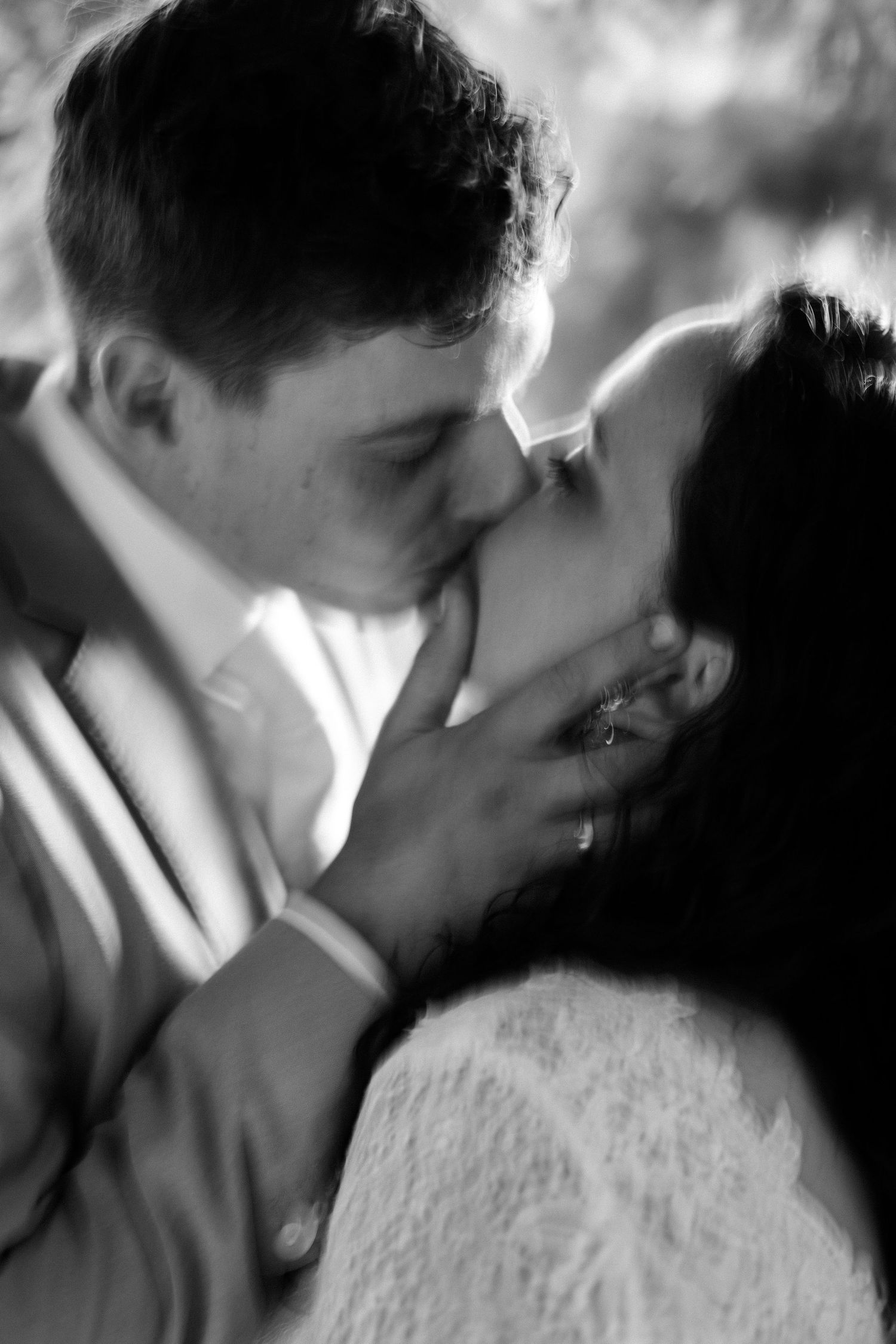 A romantic black and white photo series captures tender intimate moments between a couple.