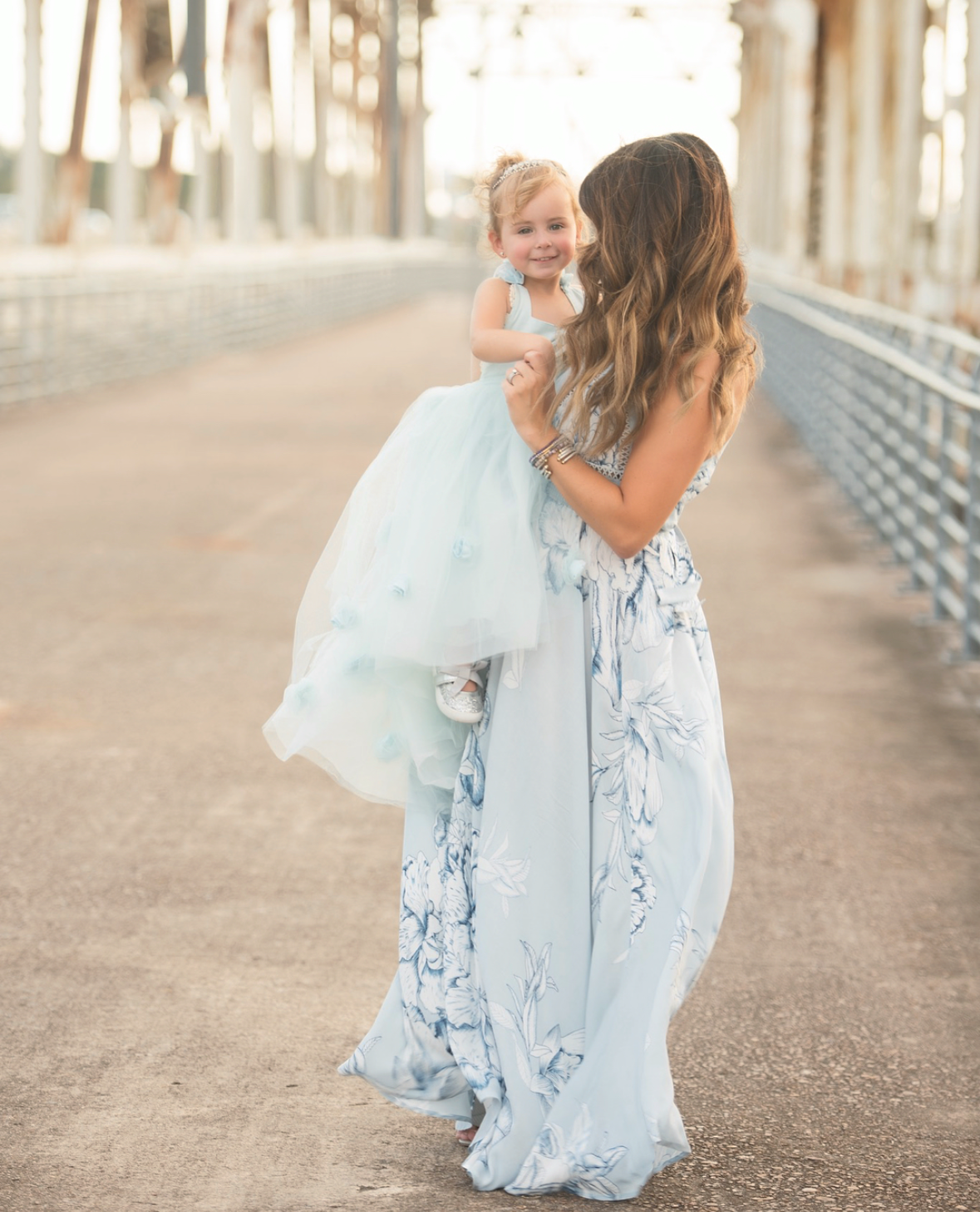 mother and daugher on a the bevil jarrel memorial bridge in kingwood