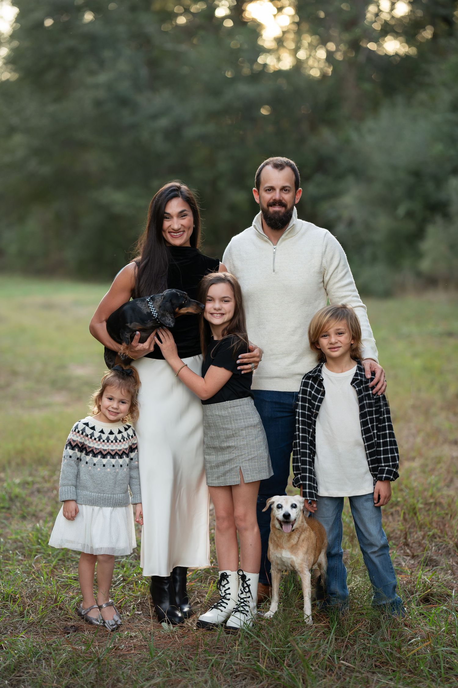 posed family with pets in cypress texas by kayleigh kannady photography