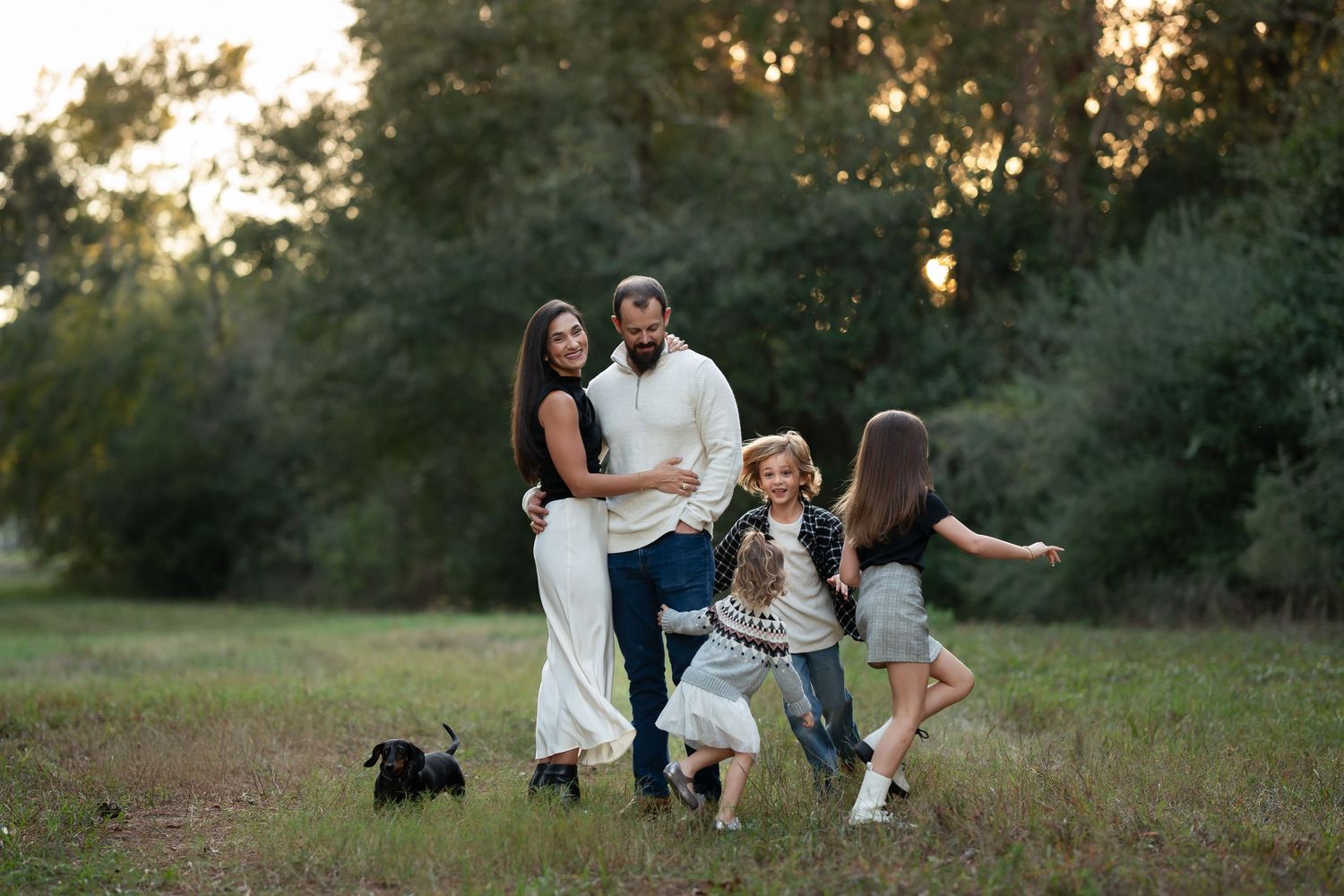 Kayleigh Kannady Photography capturing candid moments during lifestyle session. family running around in golden hour