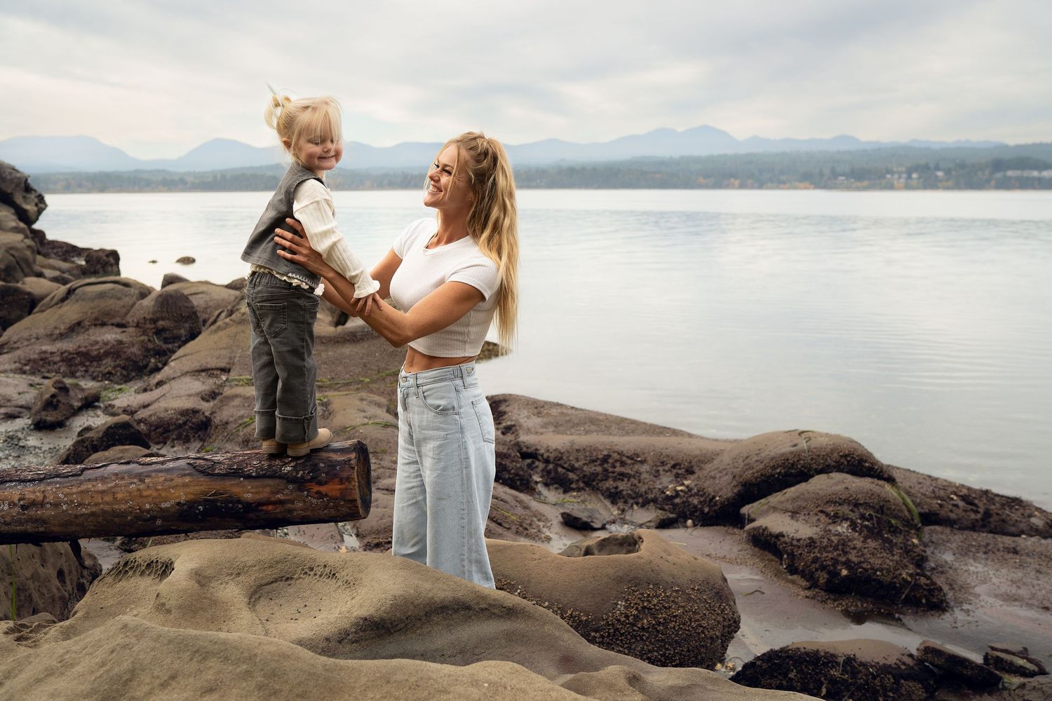 Nanaimo, BC family photographer capturing a joyful family playing together outdoors