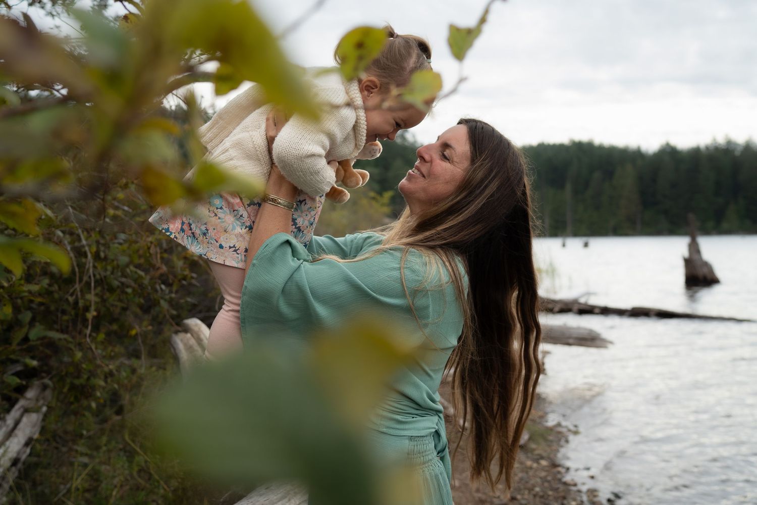 Nanaimo, BC family photographer capturing a joyful family playing together outdoors