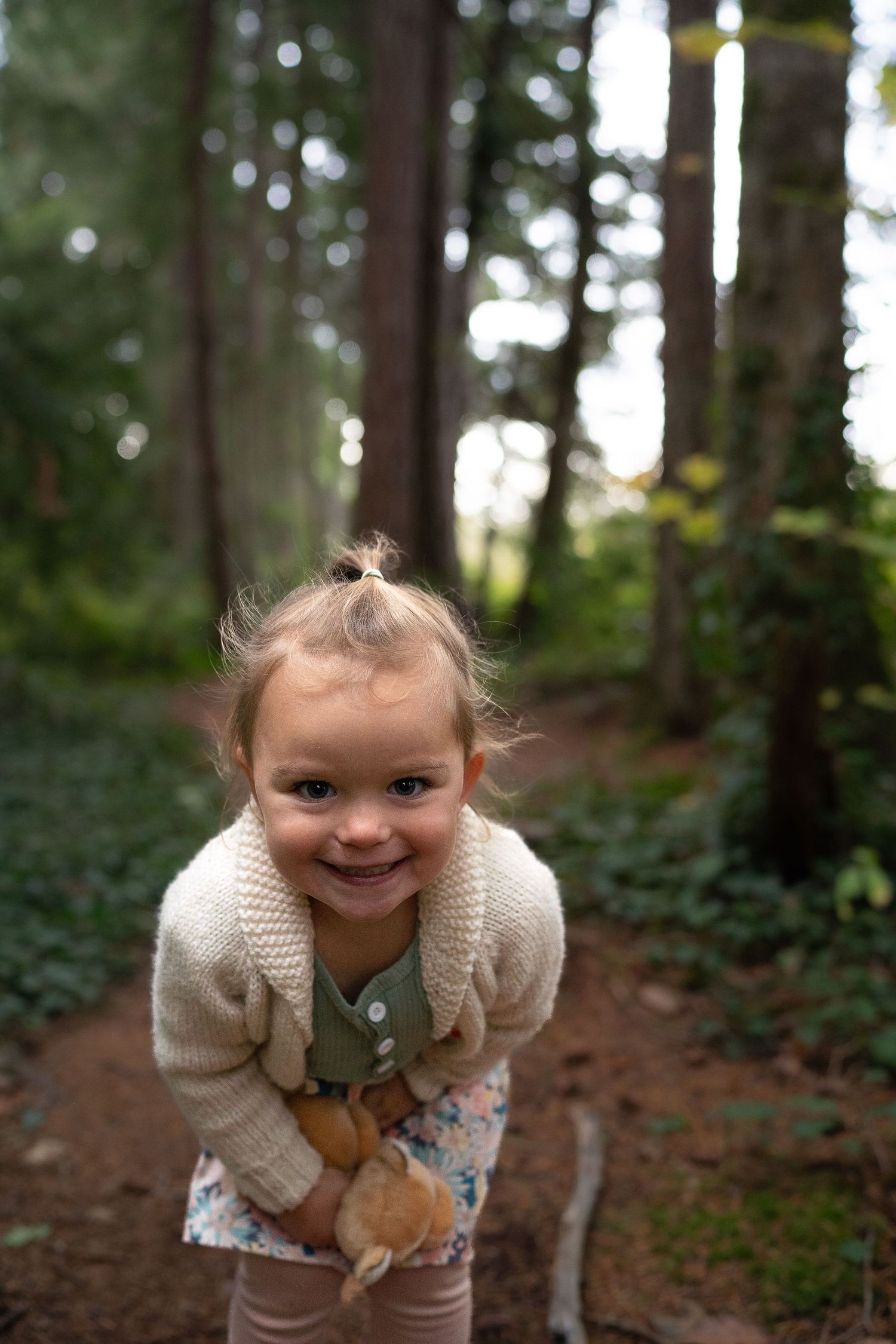 Nanaimo, BC family photographer capturing a joyful family playing together outdoors