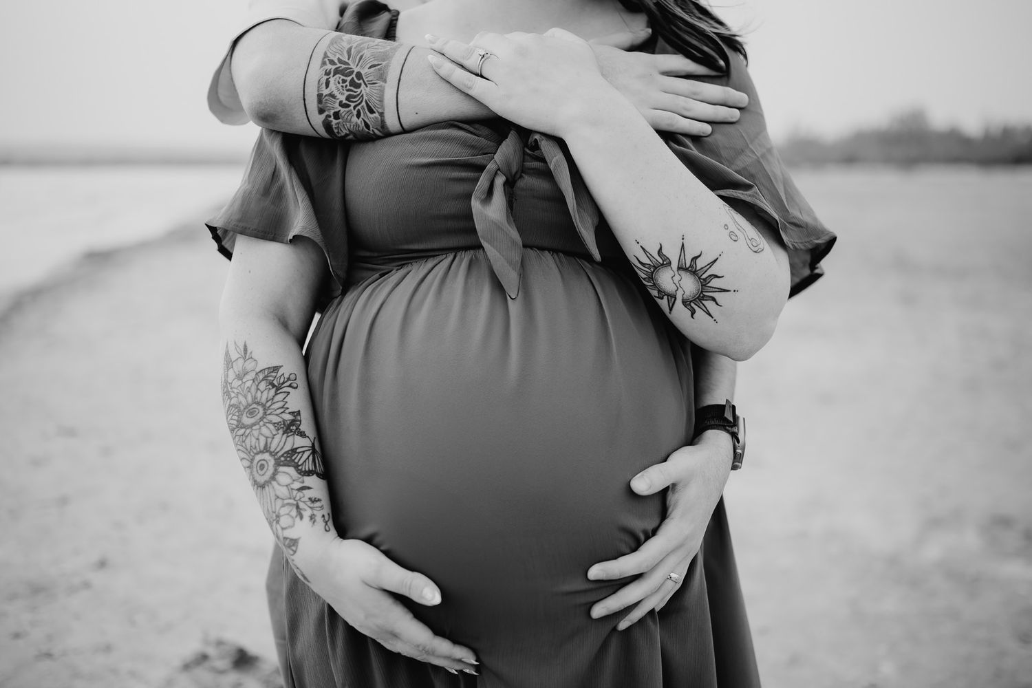 Close-up maternity photos showing loving hands cradling baby bump. Maternity photographer Ontario