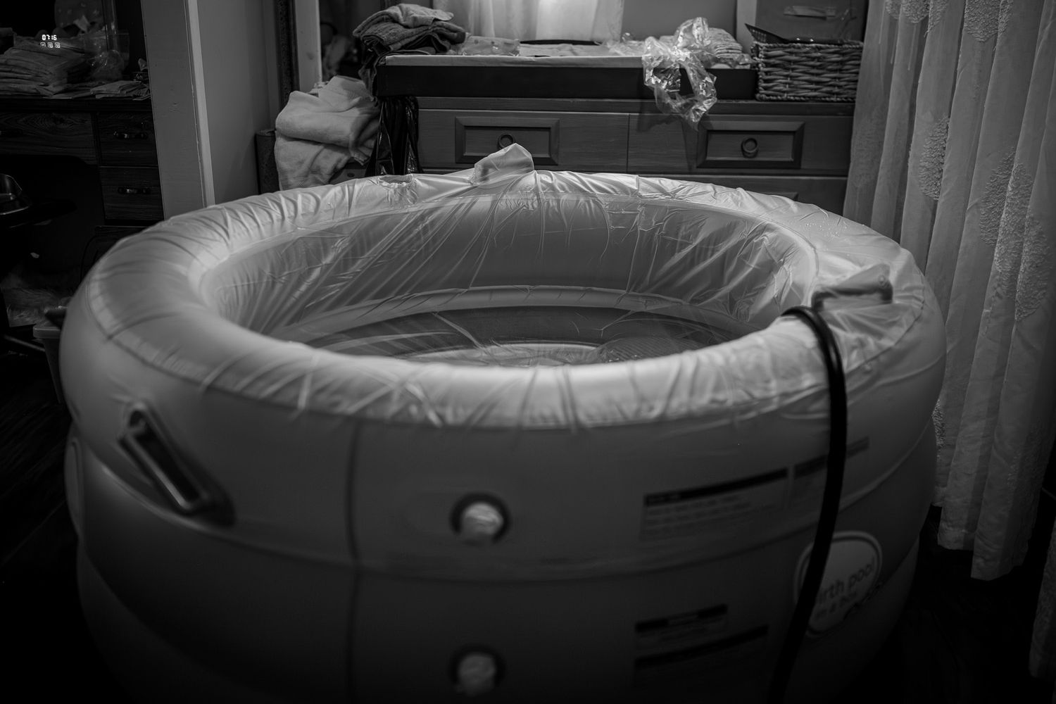 A collage showing the assembly process of an inflatable birth pool with white lining in a home setting.