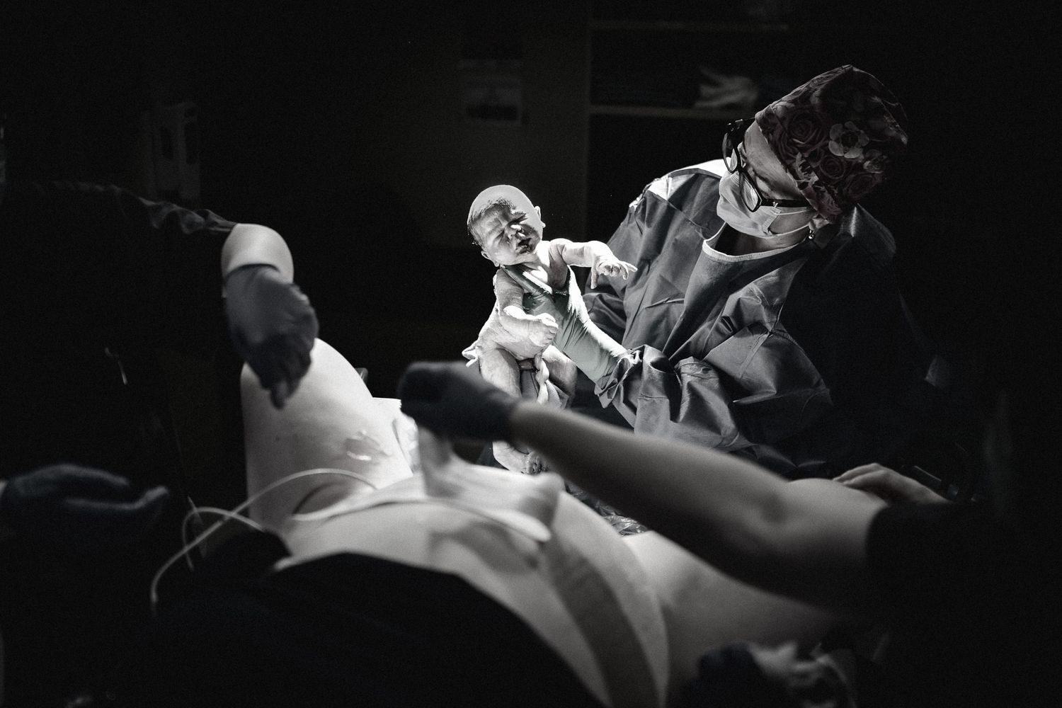 A dramatic black and white scene from a vintage horror movie showing a person in distress.