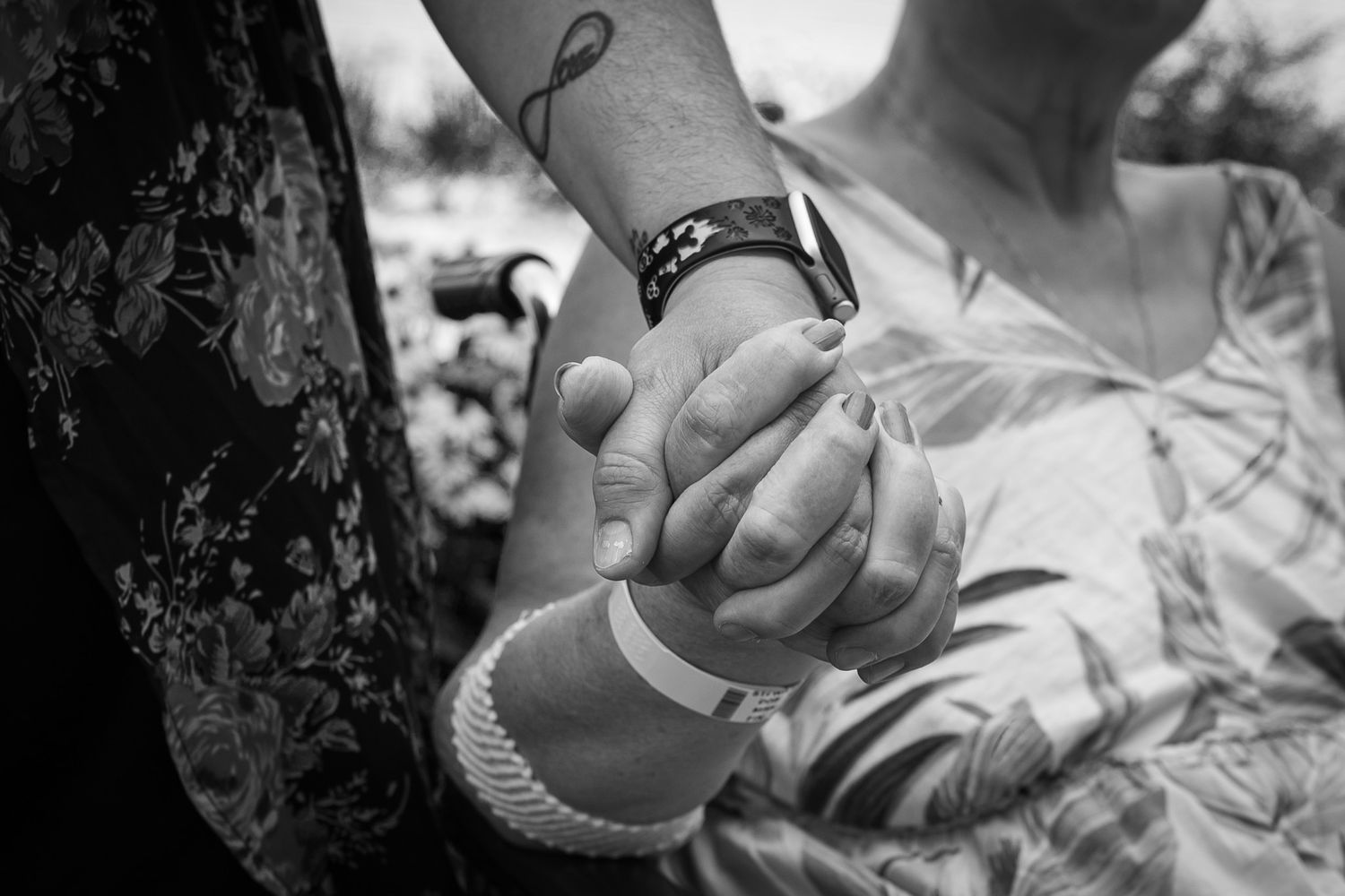 A collection of black and white photographs showing tender moments between parents and newborn babies.