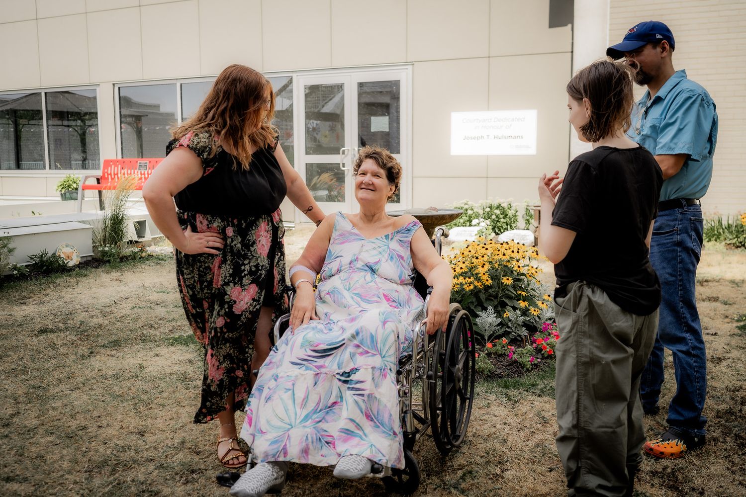 Multiple frames showing care and connection between individuals near a medical facility.
