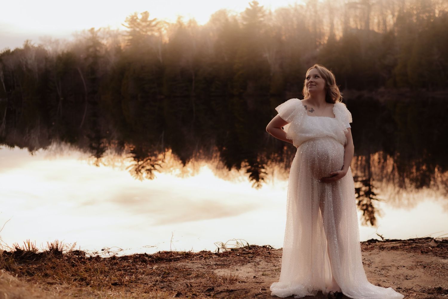 Ethereal lake scene at sunset with fog rolling over still waters. Maternity photographer Ontario