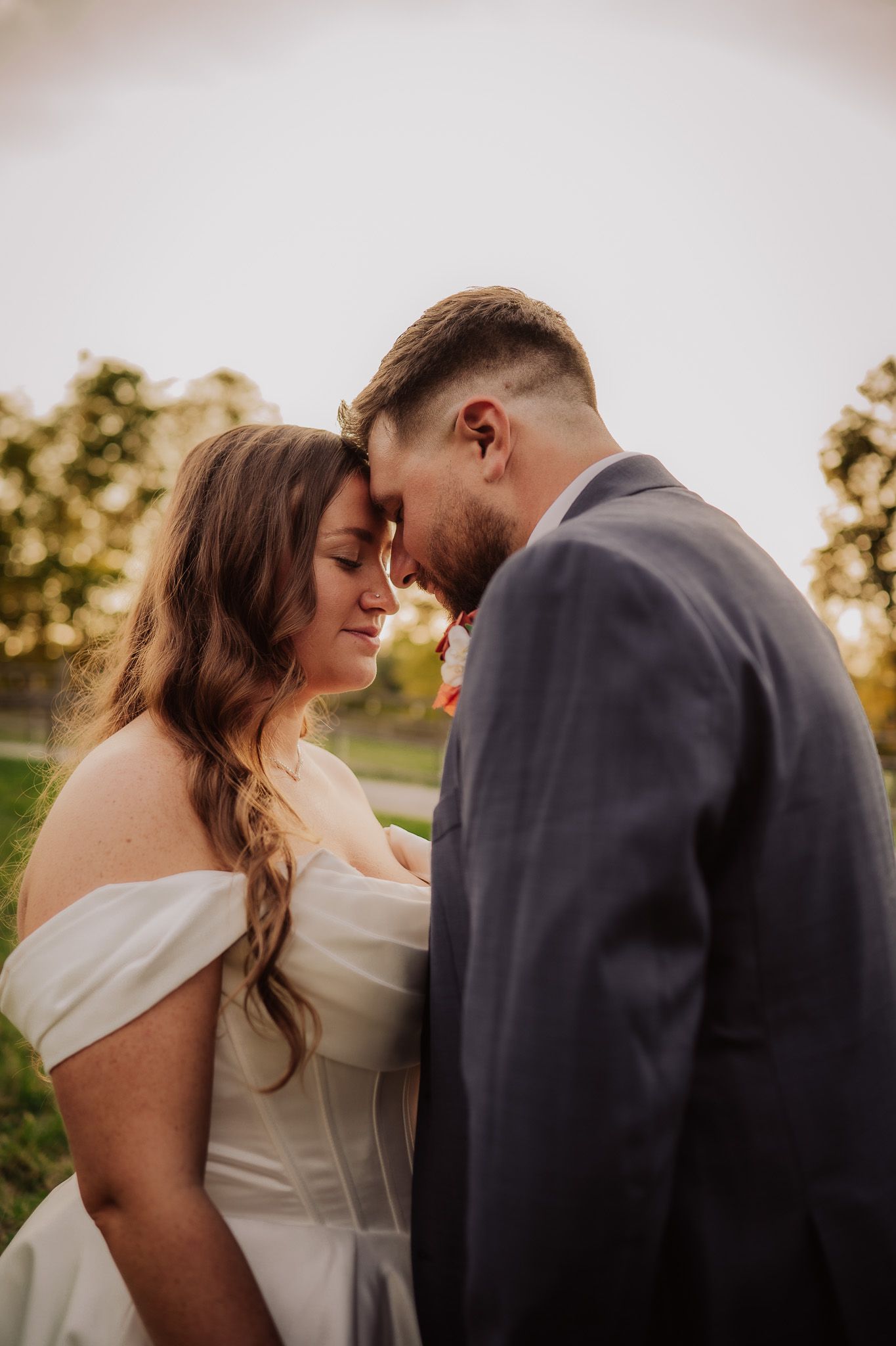 A romantic wedding couple shares an intimate moment at sunset in a series of four connected photos.