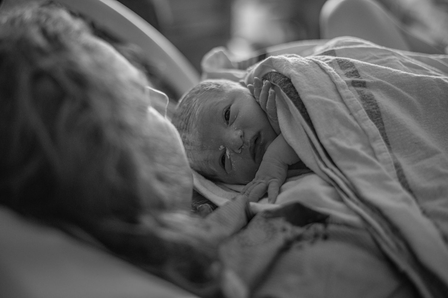 A series of black and white ultrasound images showing different stages of fetal development during pregnancy.