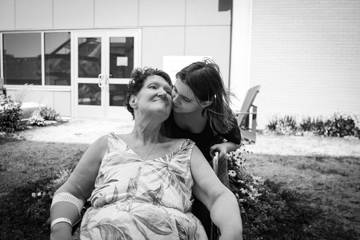 Monochrome sequence capturing gentle exchanges between granddaughter and grandmother