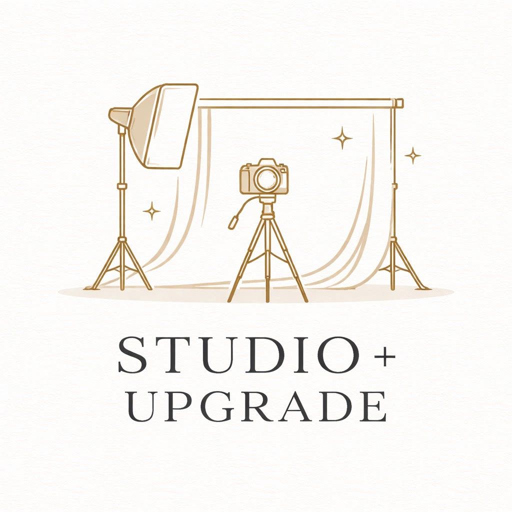 Professional photography studio setup with camera on tripod, softbox light, and white backdrop for Studio+ Upgrade.