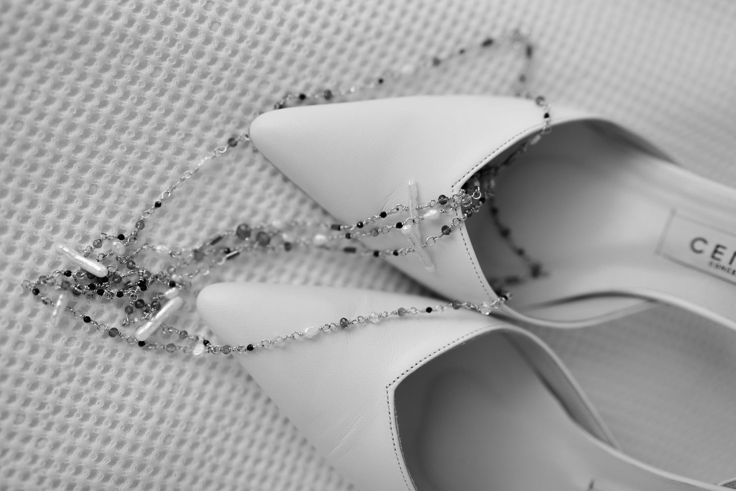 Close-up detail of delicate beading and embellishments on wedding accessories.