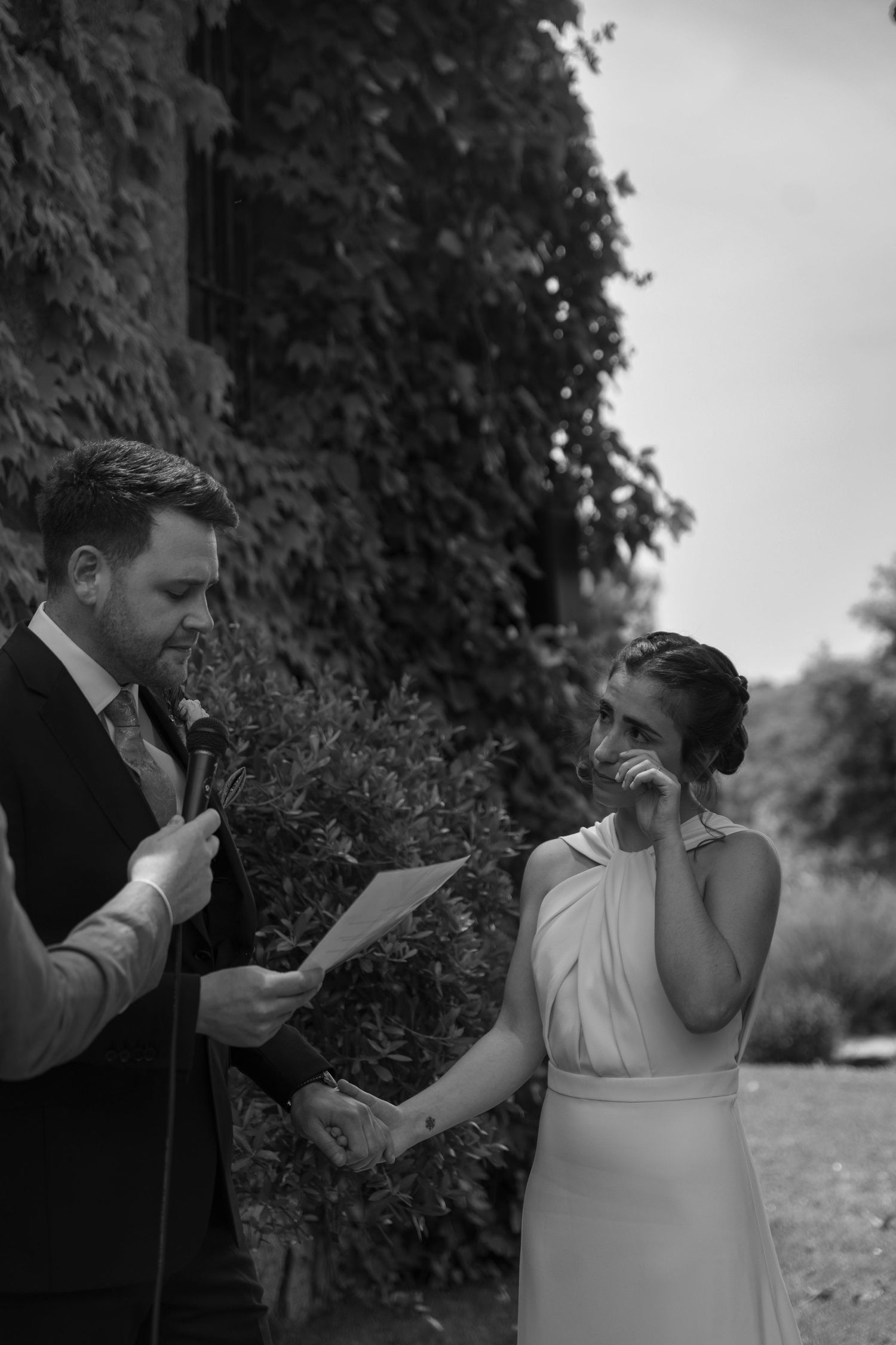 An emotional black and white moment during the wedding ceremony.