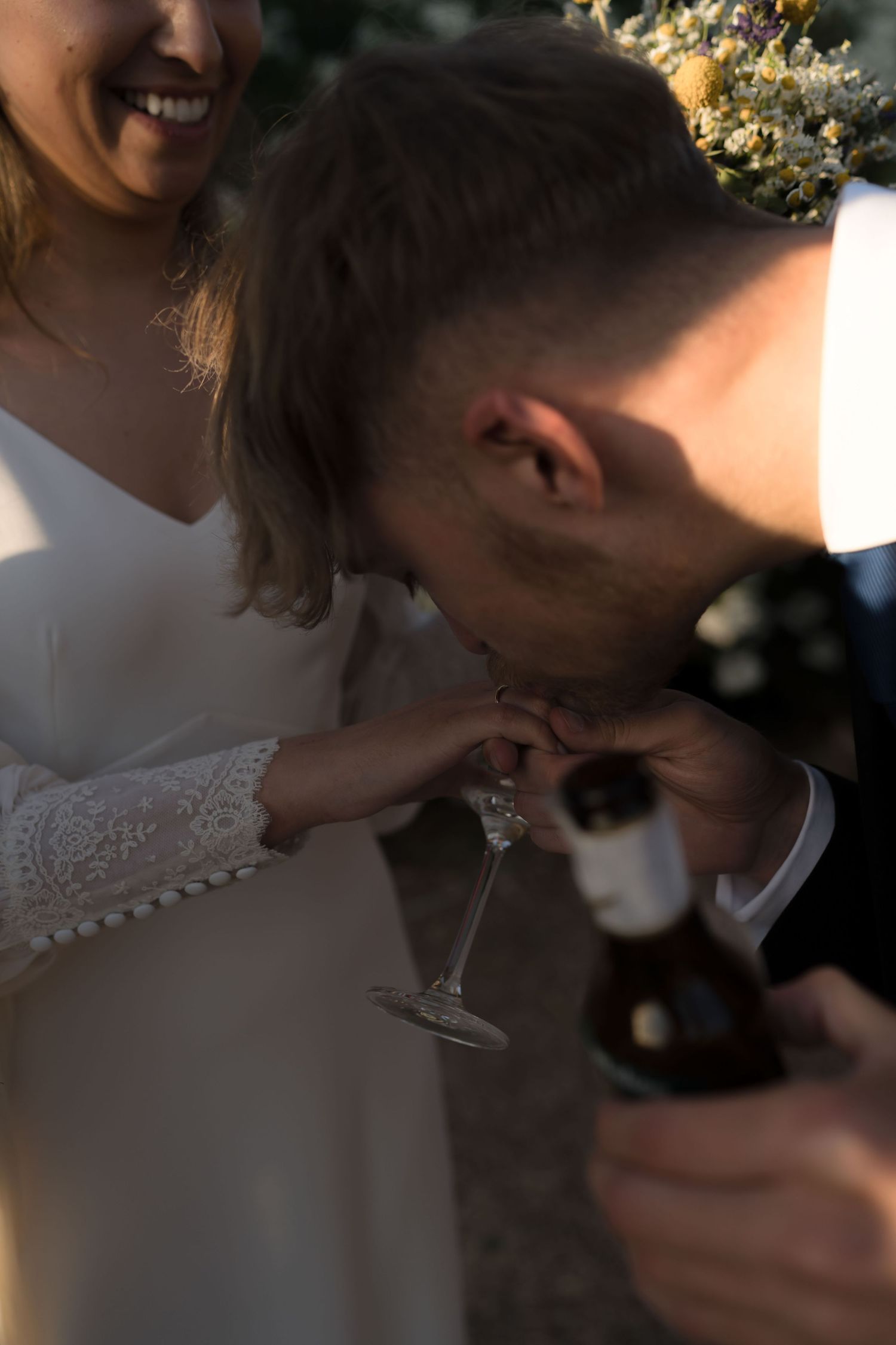 Closeup shots of a couple sharing an intimate moment during a wedding celebration.