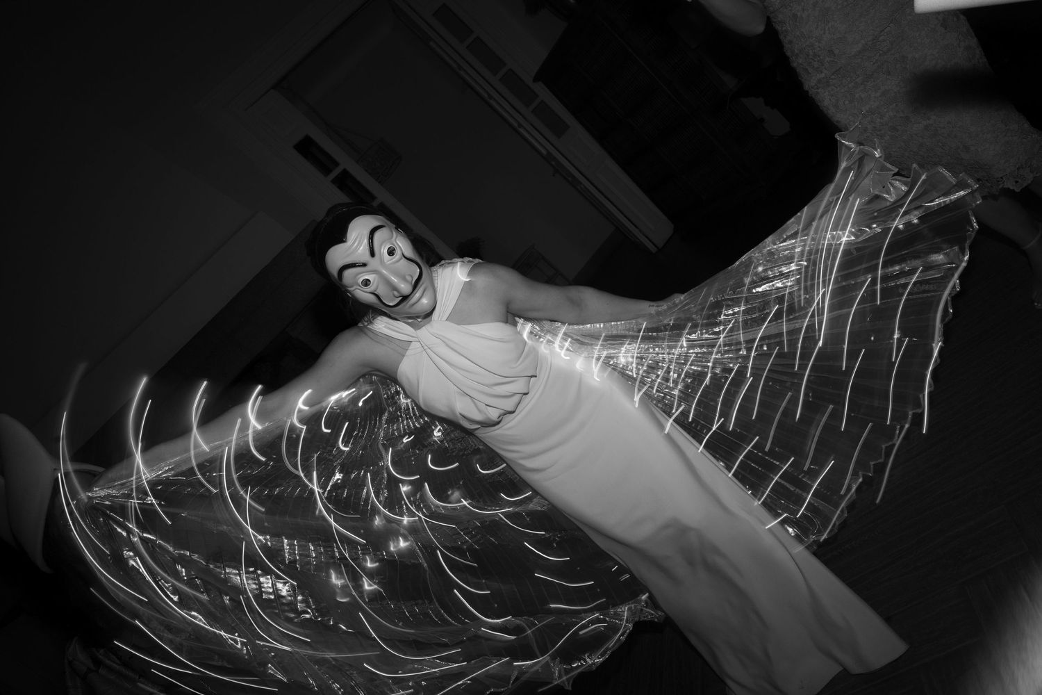 Abstract light painting trails created by moving lights in darkness.
