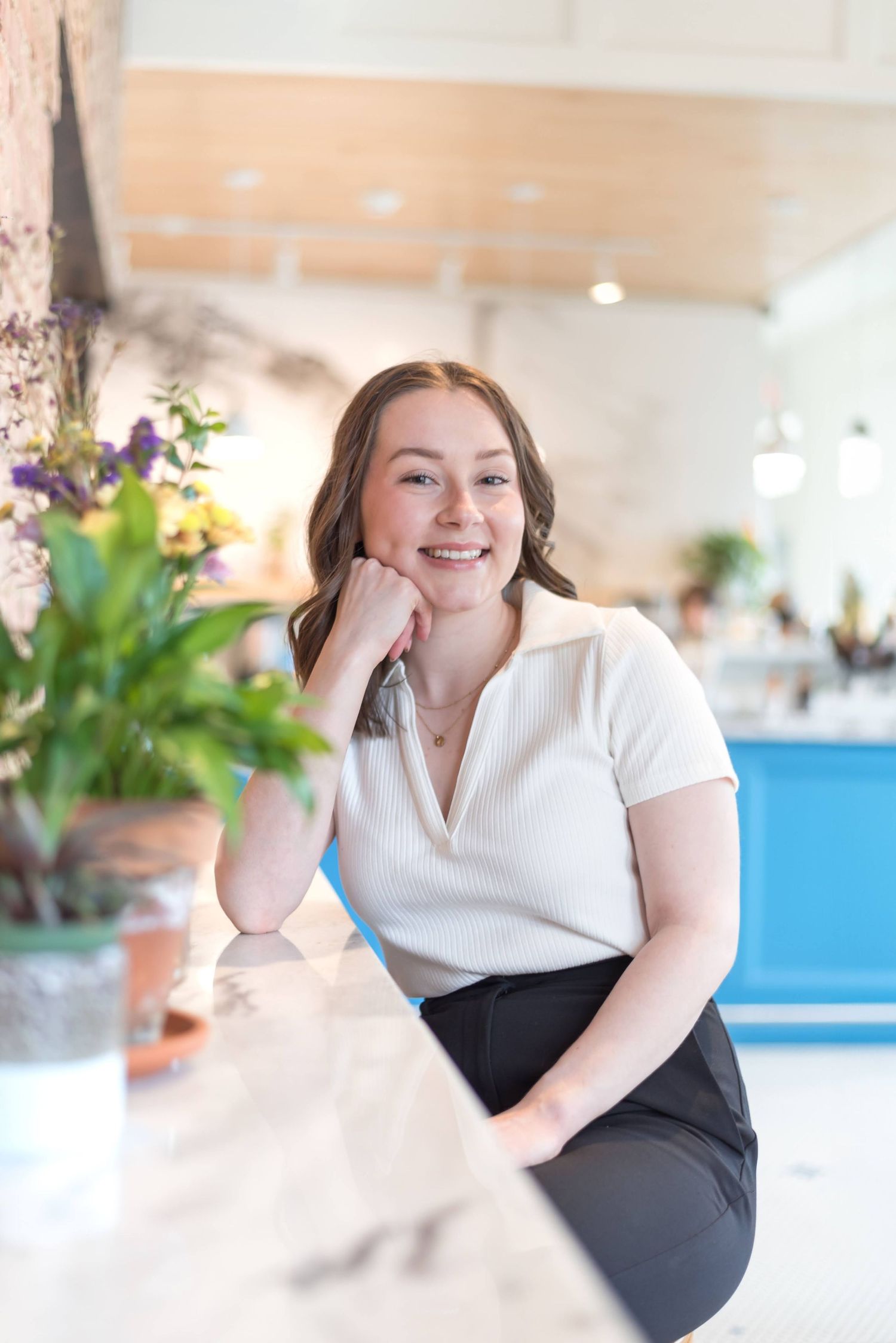 Professional portrait session in bright modern office space.