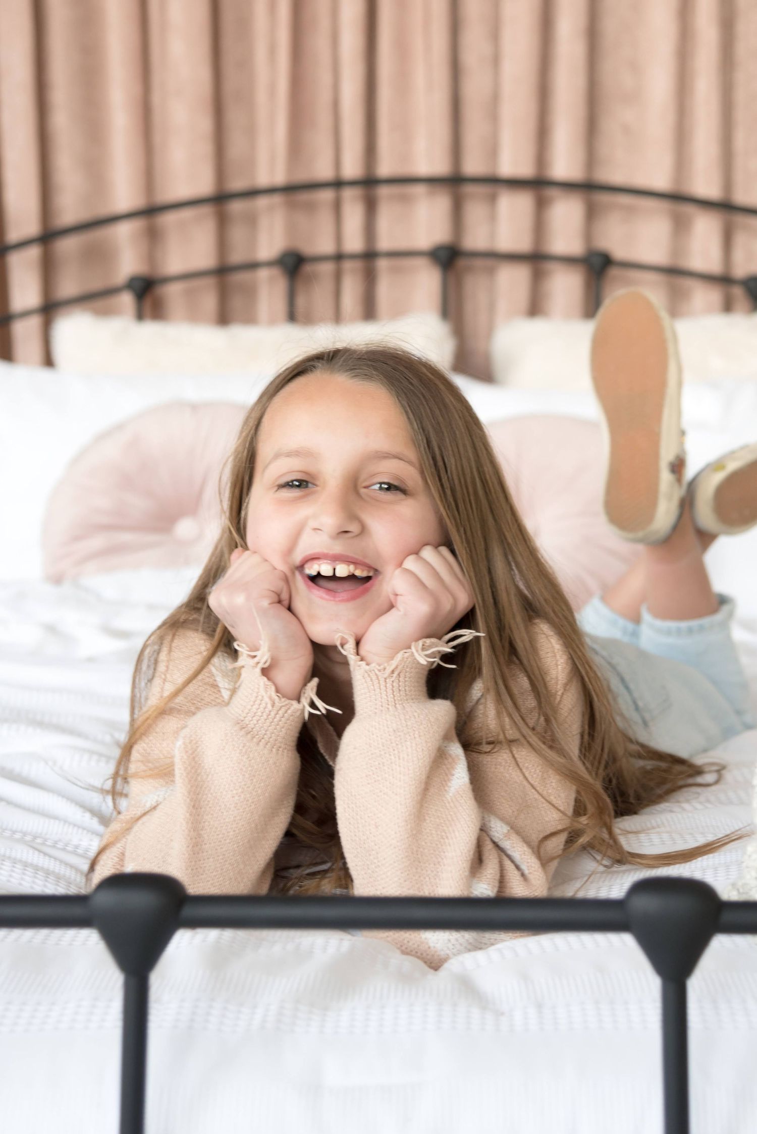 Series of playful expressions showing laughter and joy in a light-hearted photoshoot.