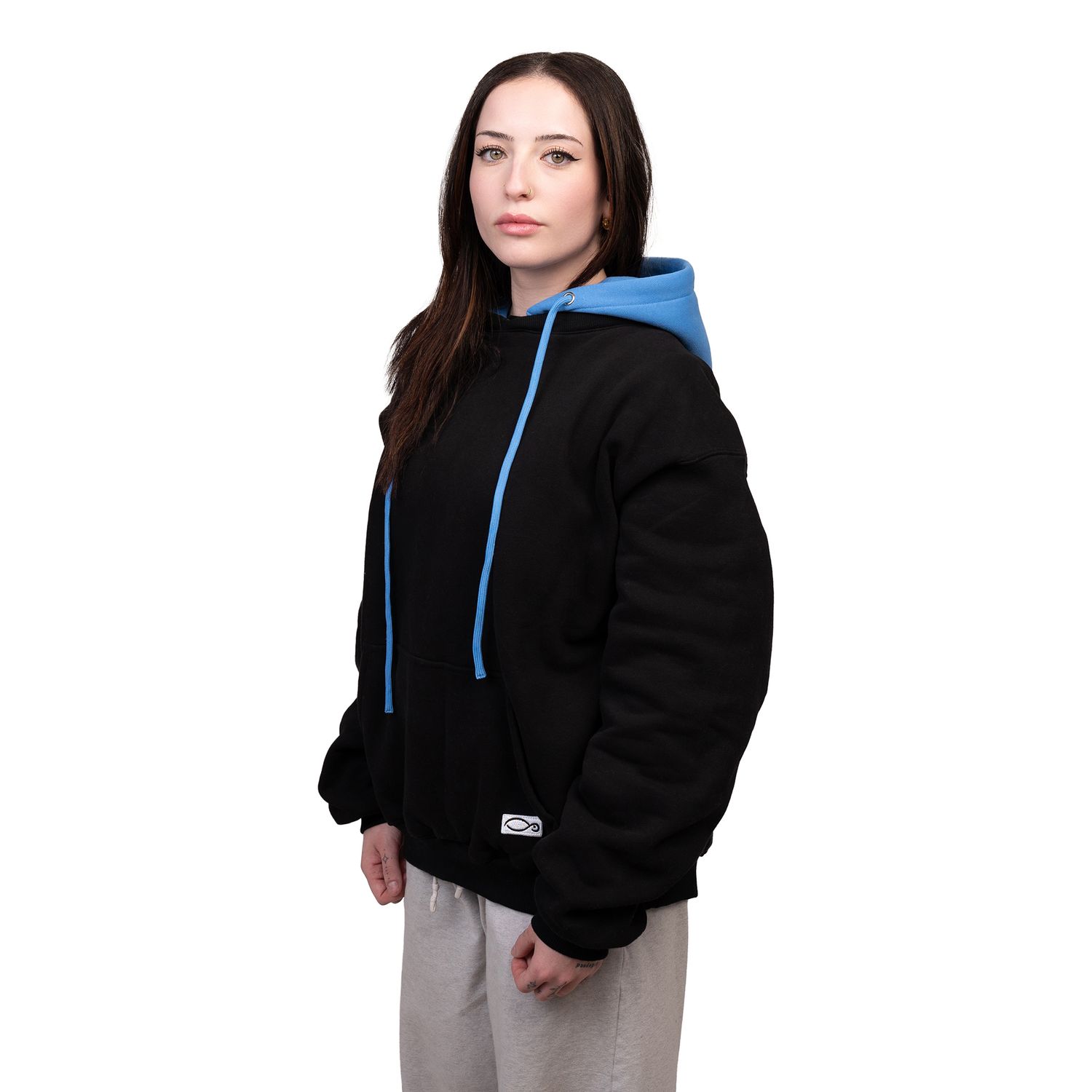 Person wearing a black hooded sweatshirt with blue drawstrings shown from multiple angles against a light background.