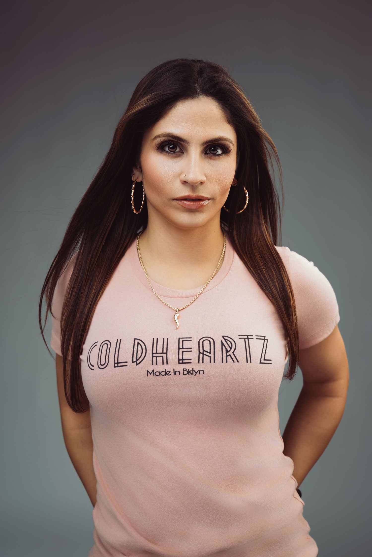 A set of cropped portrait images showing a pink sleeveless top with text design against a gray background.