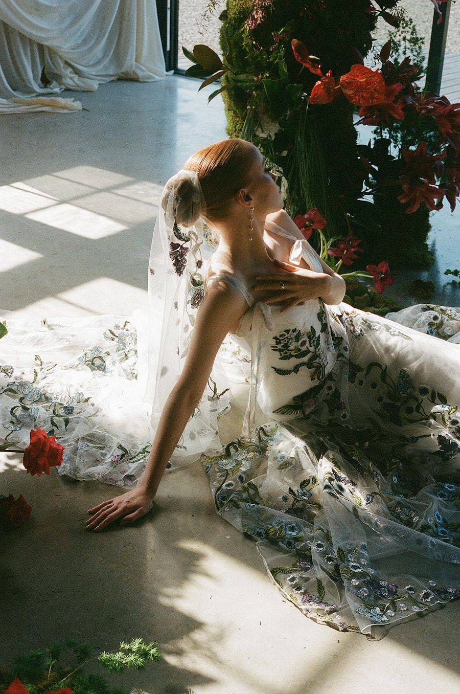 Brides poses on the floor for 35mm Film photograph at The Giraffe Shed wedding venue in Newtown, Wales.