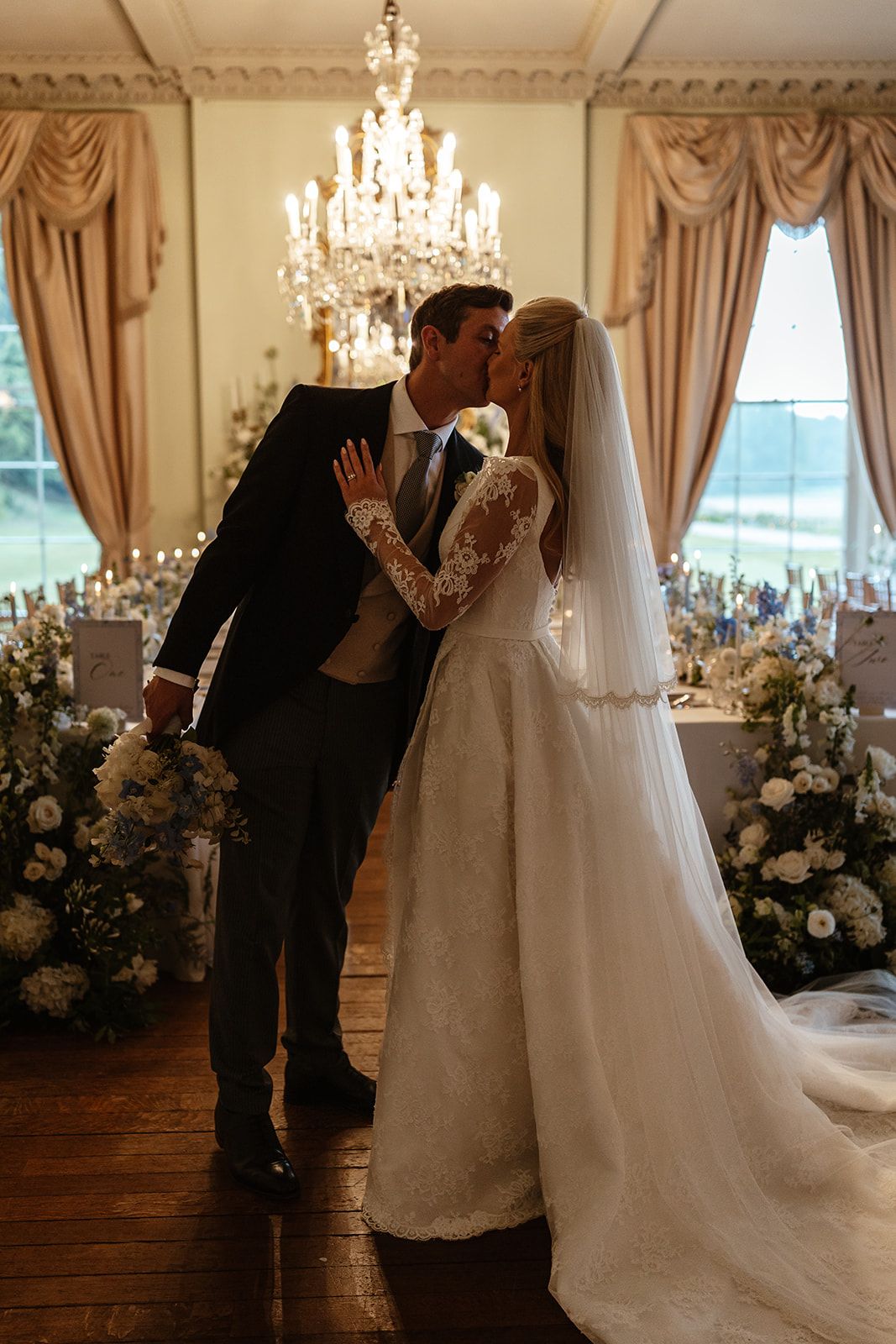 Couple kiss at beautiful wedding at Prestwold Hall in Leicestershire.