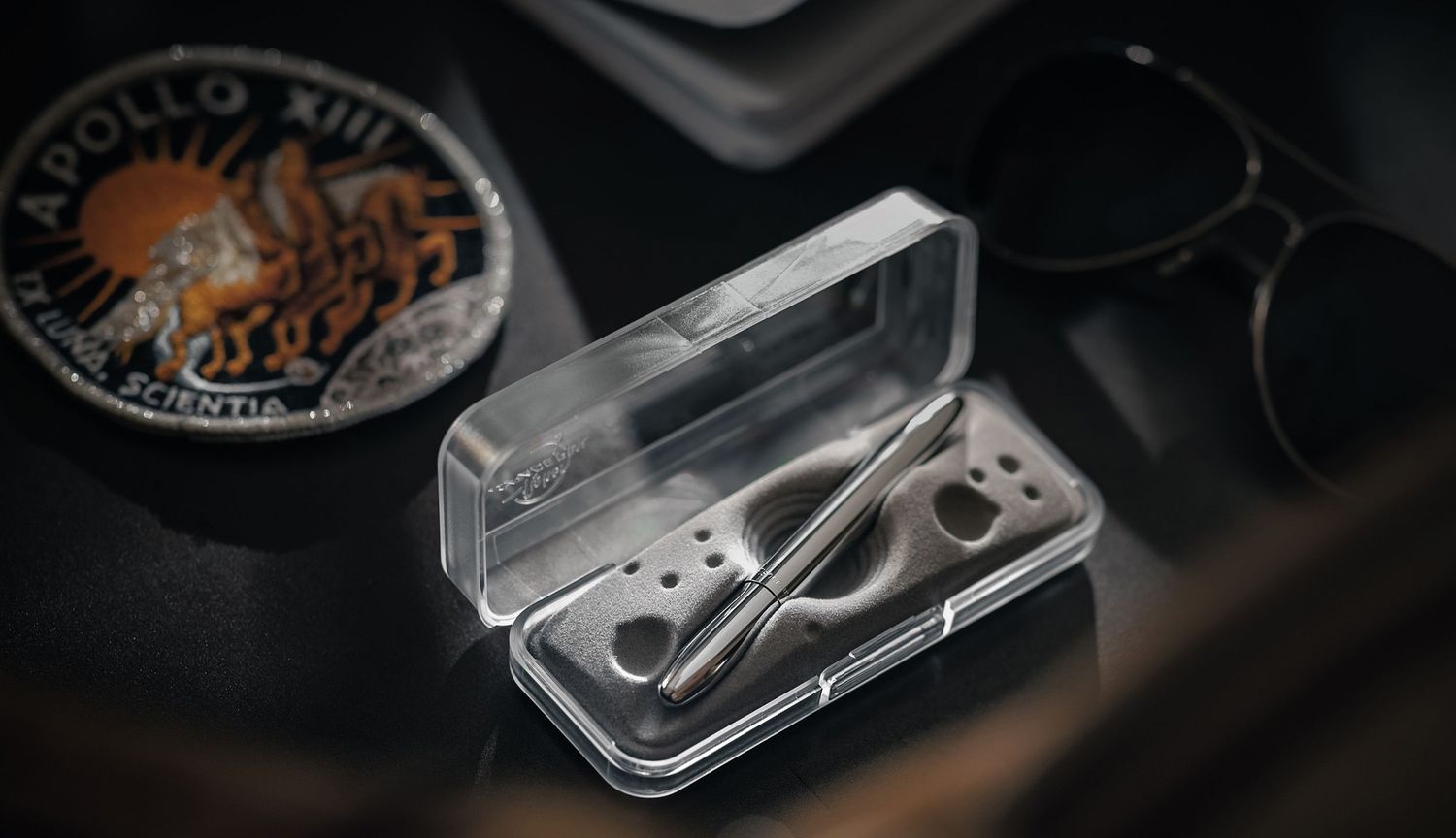 Series of close-up shots showing vintage American coins being placed into protective clear plastic holders for collection.