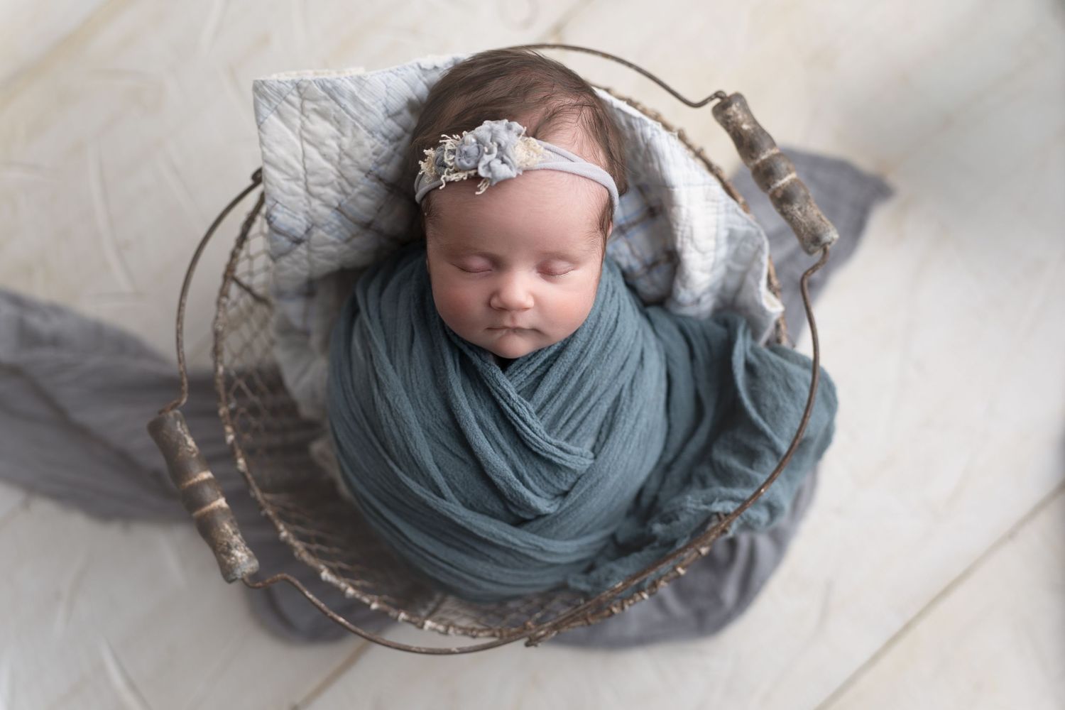 Baby girl in blue in a tiny chair.  Photo by Hatched Photography, serving Madison, Dodgeville, Verona, Sun Prairie, Monona, WI