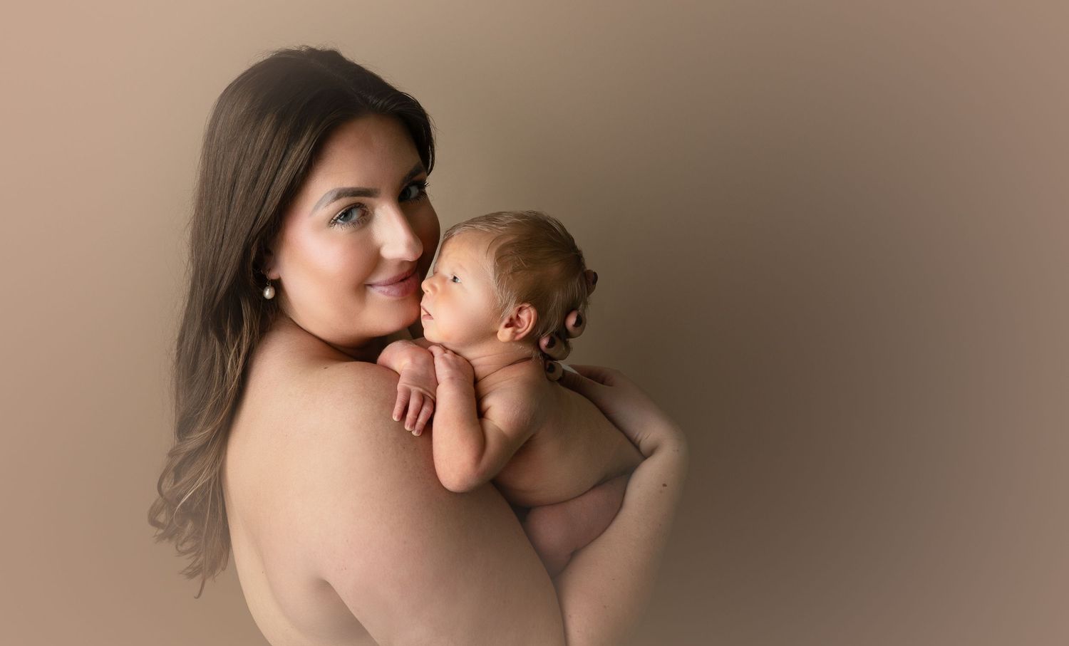 artful, and tasteful nude photo of mother with newborn. hatched newborns. Southwest Wisconsin.