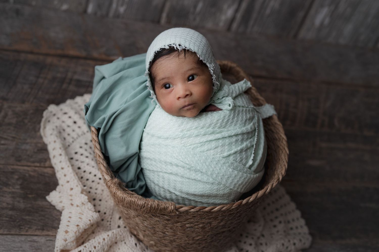 Wide awake baby in aqua green. Verona, WI