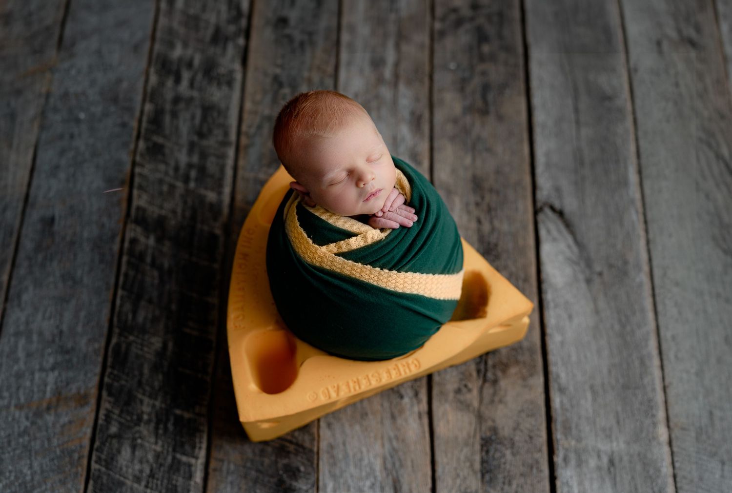 Baby in Green Bay Packer cheesehead