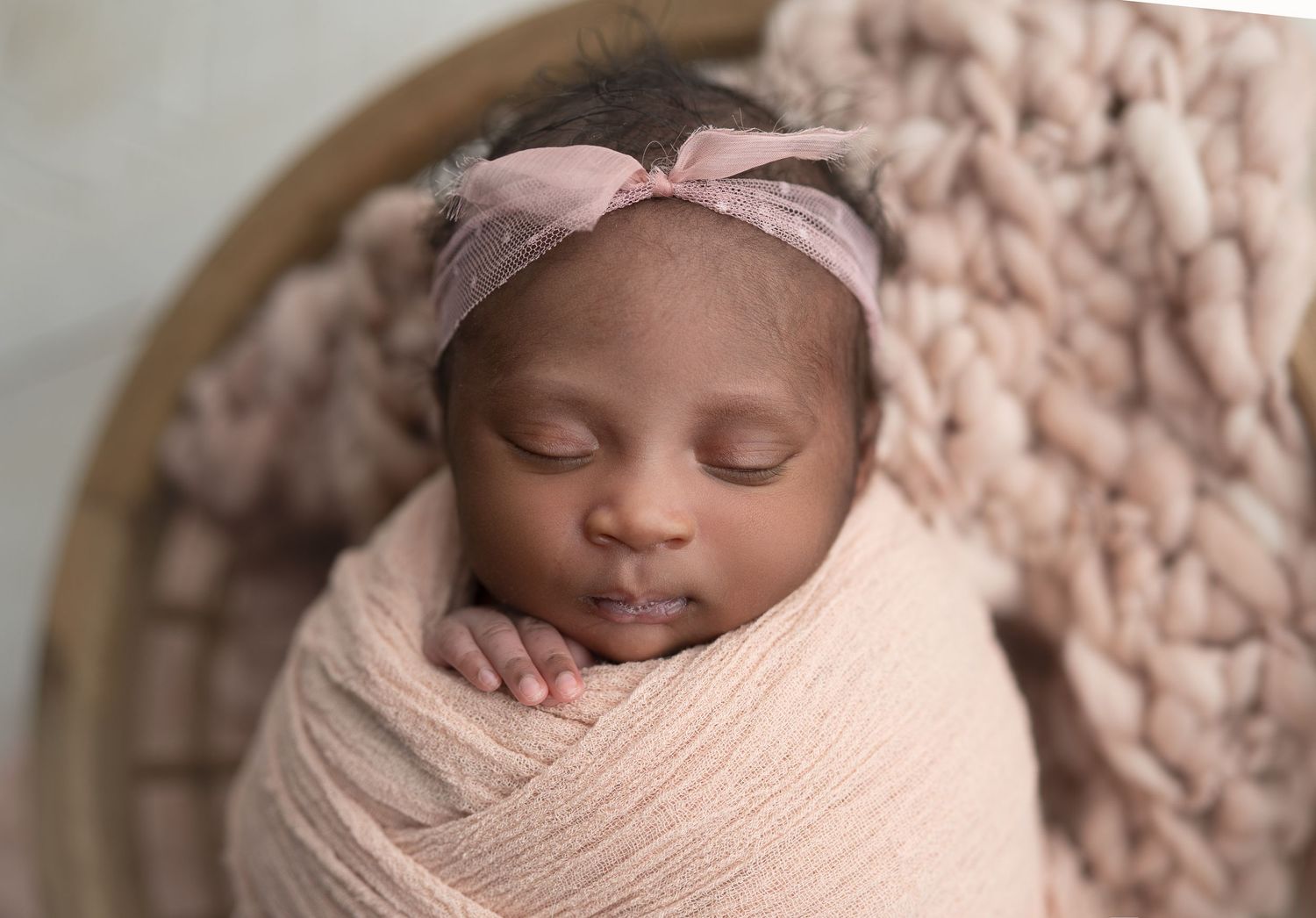 Newborn baby in vintage basket. Madison, WI newborn photos