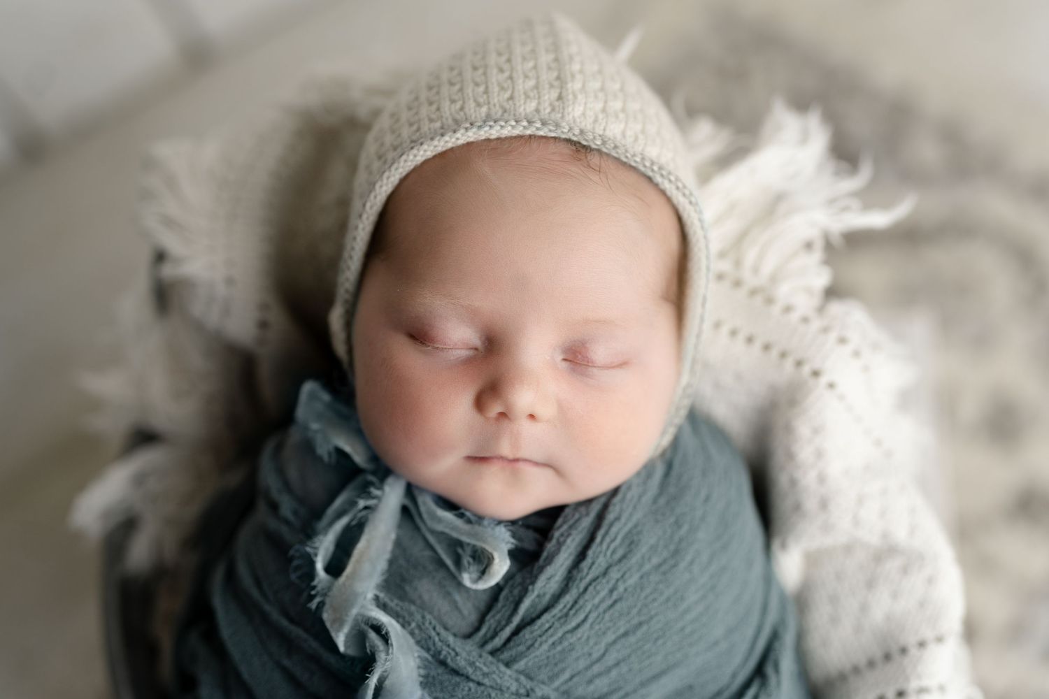 Newborn in prop bucket, milestone session Madison, WI