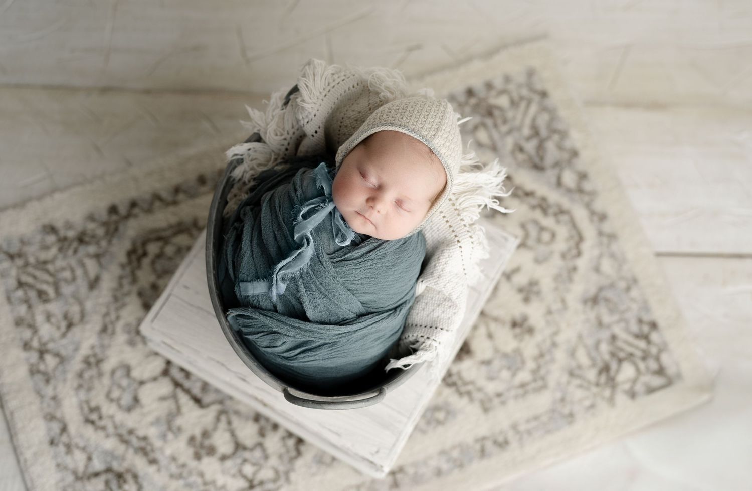 Newborn in prop bucket, milestone session Madison, WI