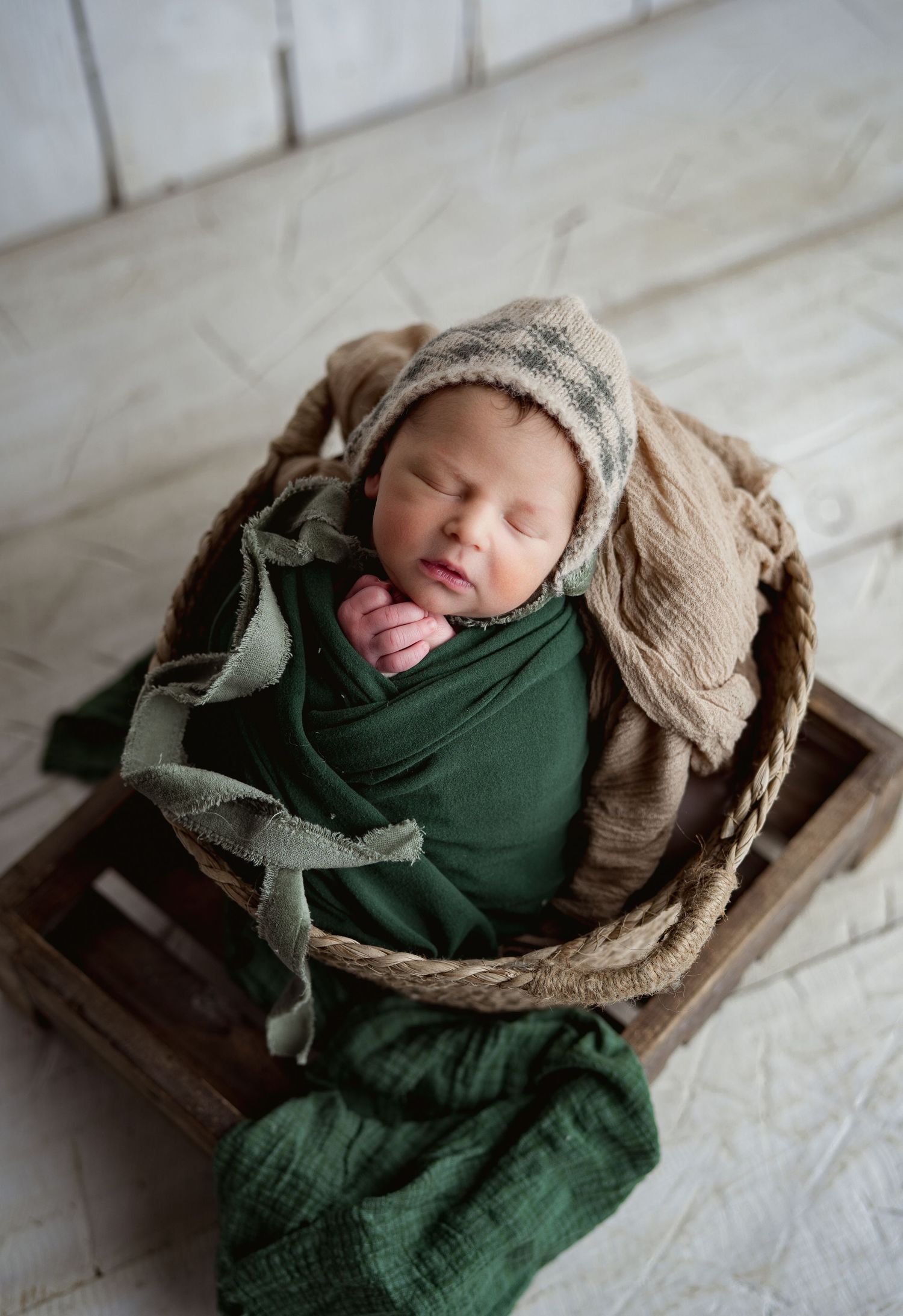 Baby in green. Hatched Newborn Photography