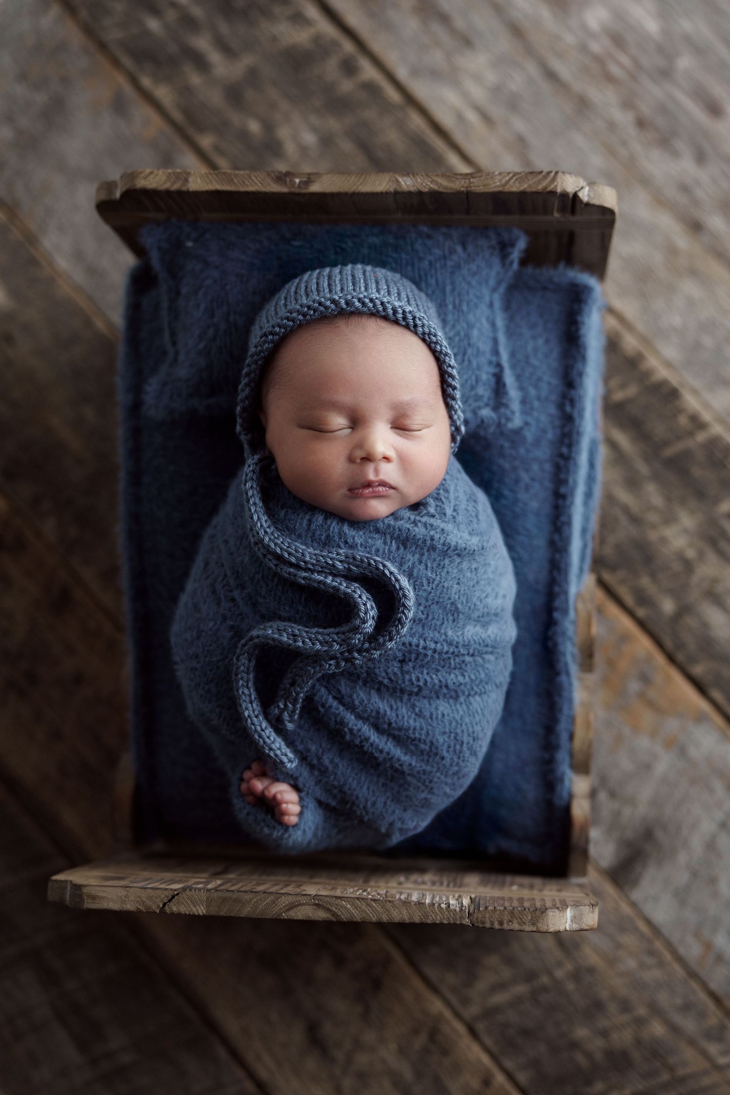 Newborn in basket with cute props, studio photography Madison, Verona, Middleton, Mount Horeb, Sun Prairie, Wisconsin and surrounding area.