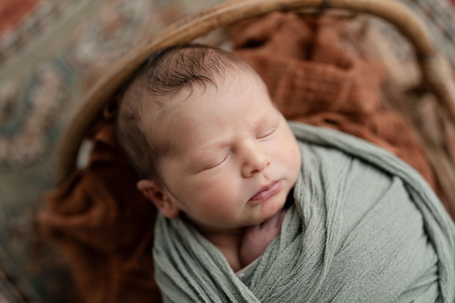 Baby in green. Hatched Newborn Photography
