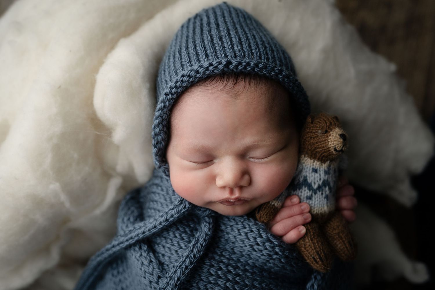 Baby in blue with little teddy bear. Hatched Newborn and Family Photography. Madison, Monona, Verona, Mount Horeb, WI