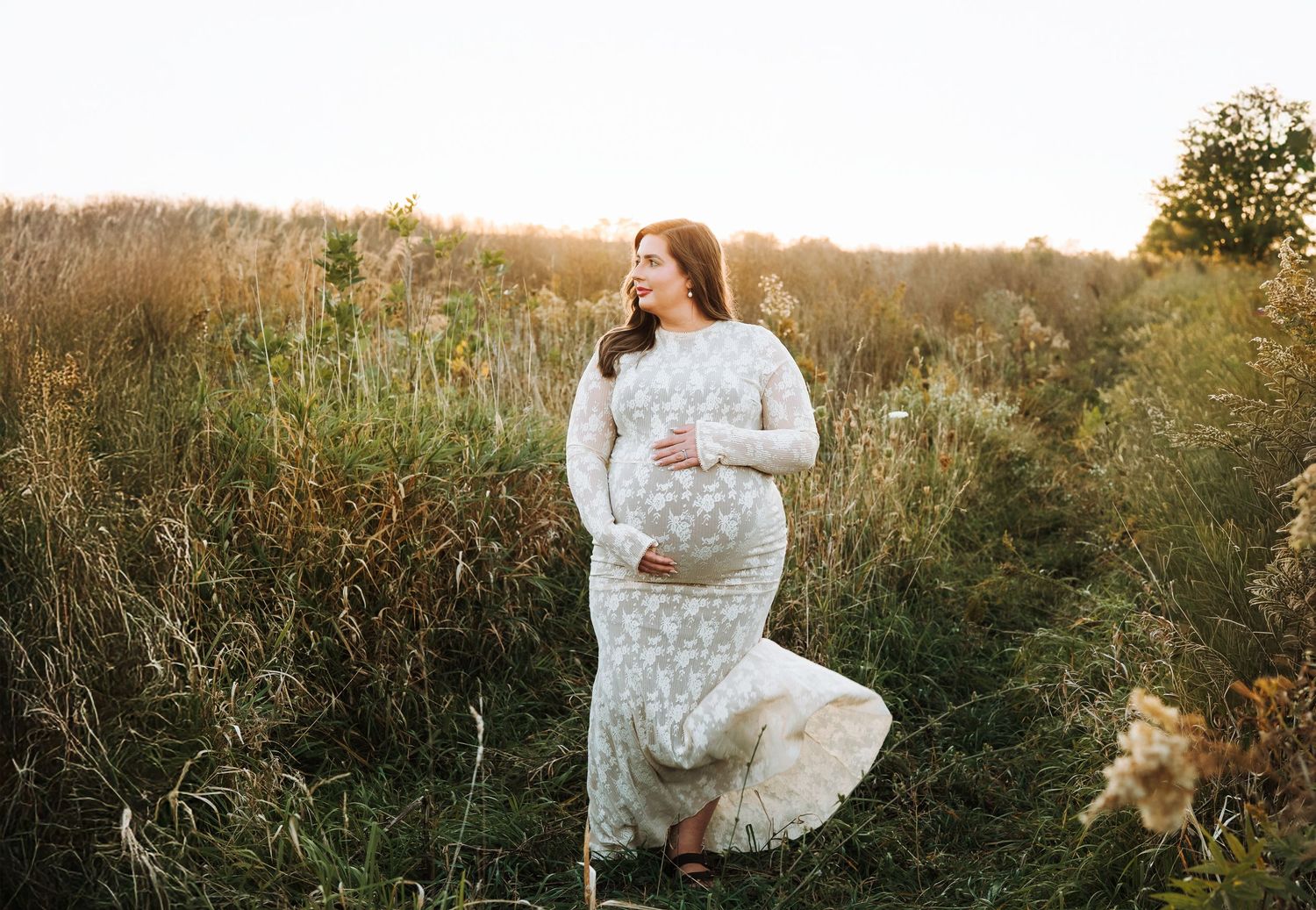 Gorgeous mother to be surrounded by tall grass. Hatched Newborn and Family Photography. Madison, Monona, Mount Horeb, Verona, Wisconsin,