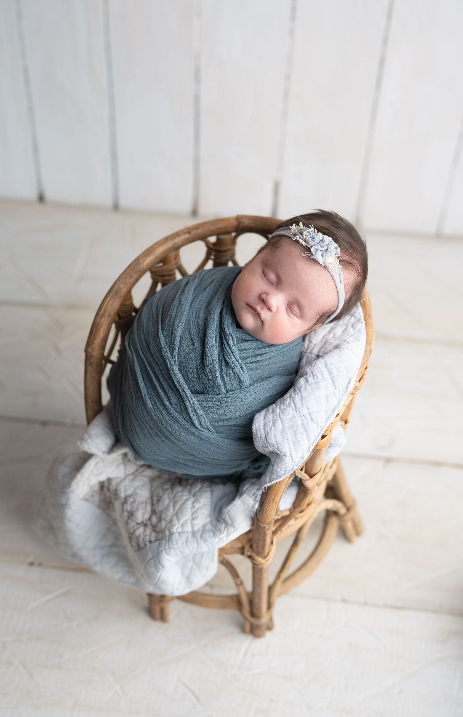 Baby girl in blue in a tiny chair.  Photo by Hatched Photography, serving Madison, Dodgeville, Verona, Sun Prairie, Monona, WI