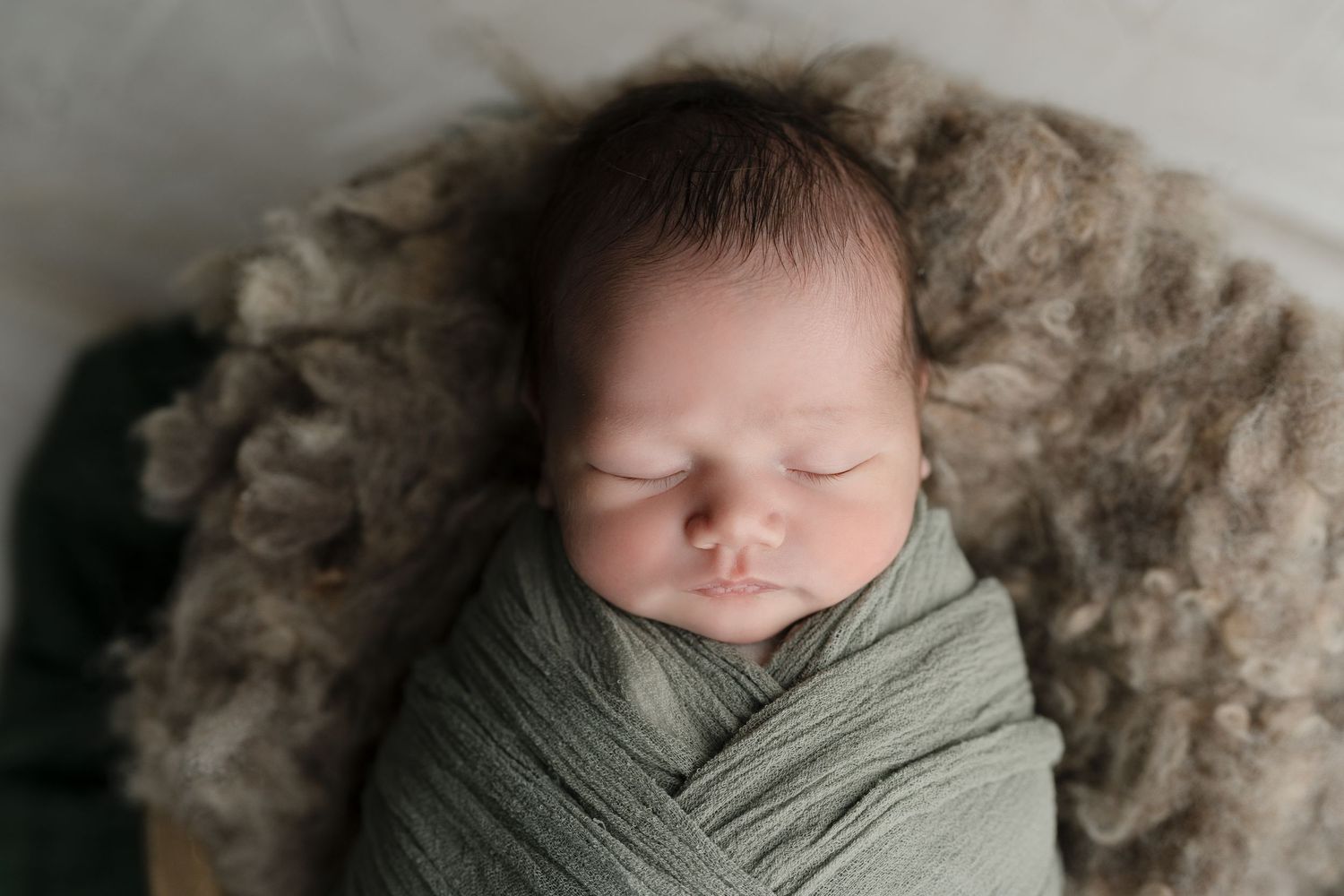 Dreamy baby snuggled in fur. Hatched Newborn and Family Photography. Madison, Monona, Verona, Mount Horeb, WI