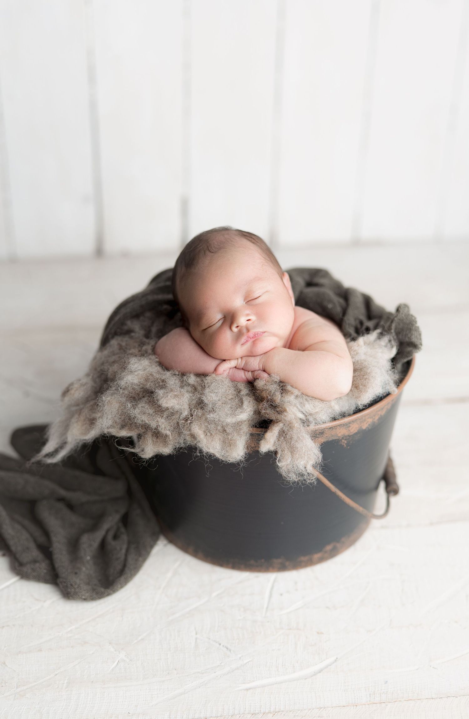 Sleeping baby in a bucket. Madison, Wi Hatched Newborn Photography. Maternity, Family and Child photography.