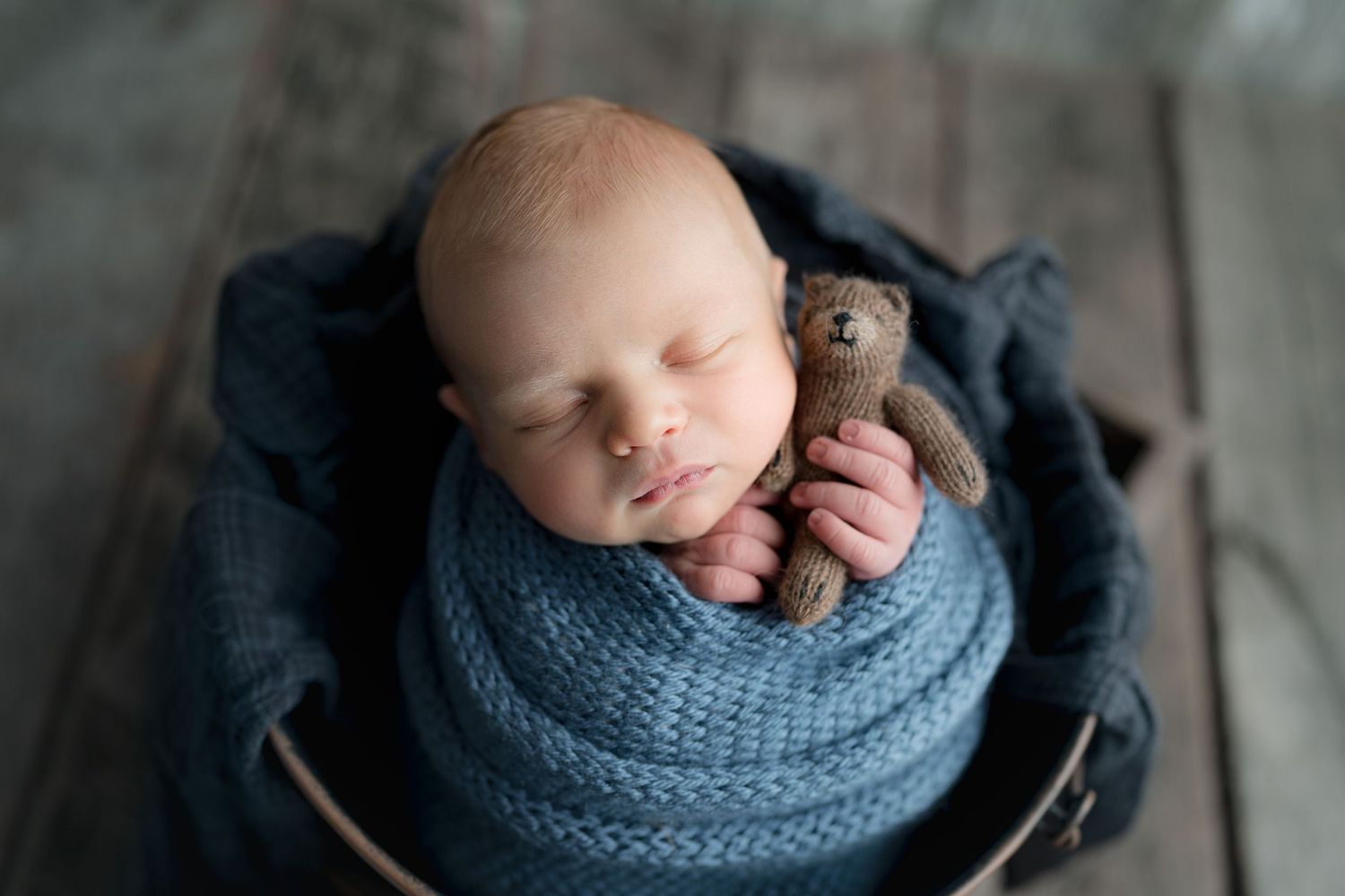 baby with bear, blue wrap