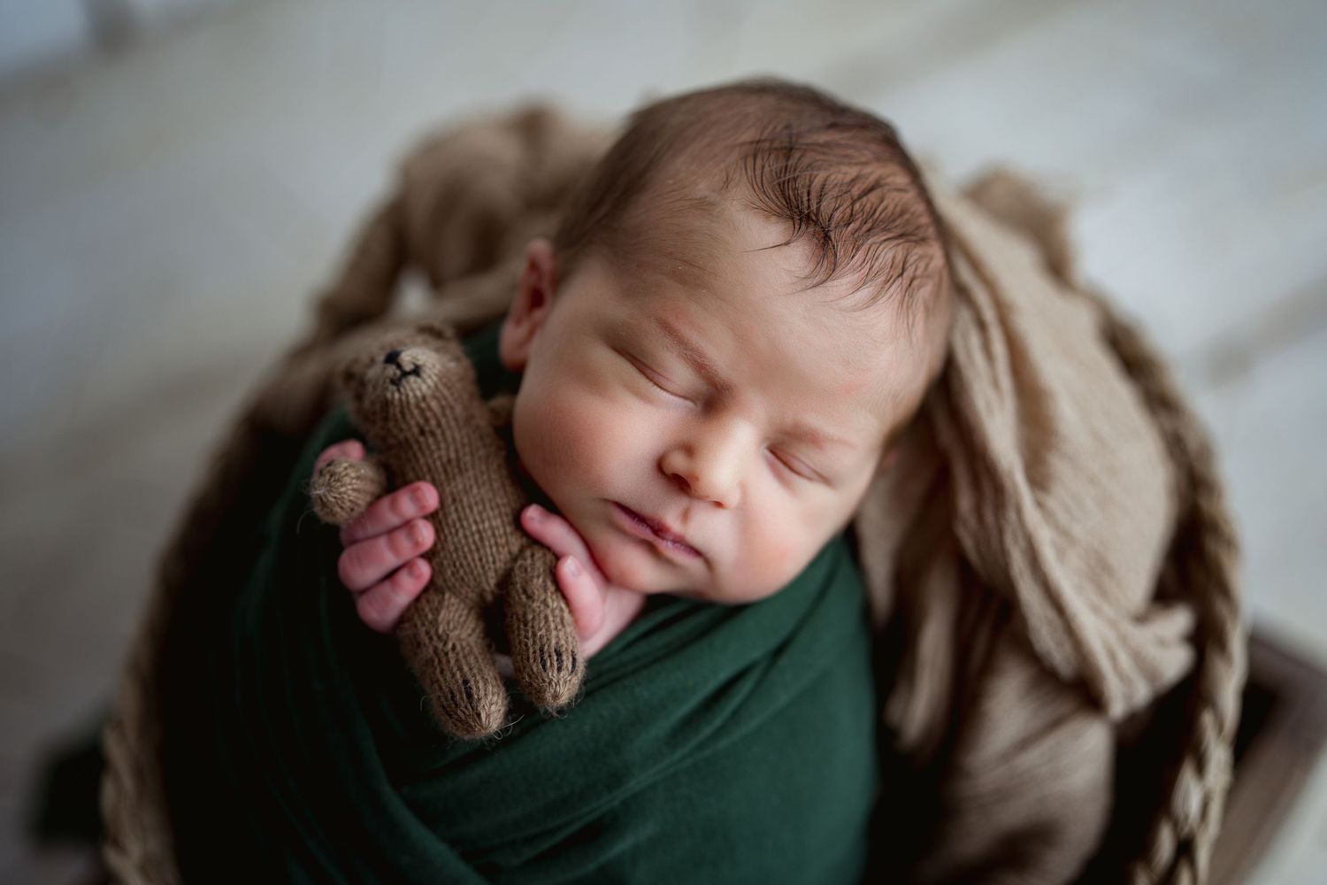 Baby in green. Hatched Newborn Photography