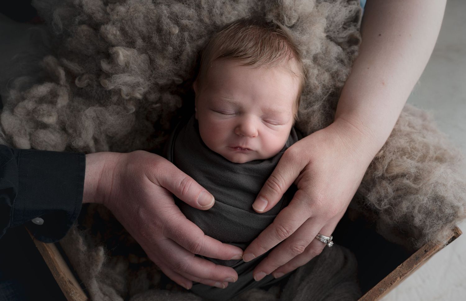 Baby with parent's hands. Madison, WI Mount Horeb, Wi Verona, WI Newborn Photography